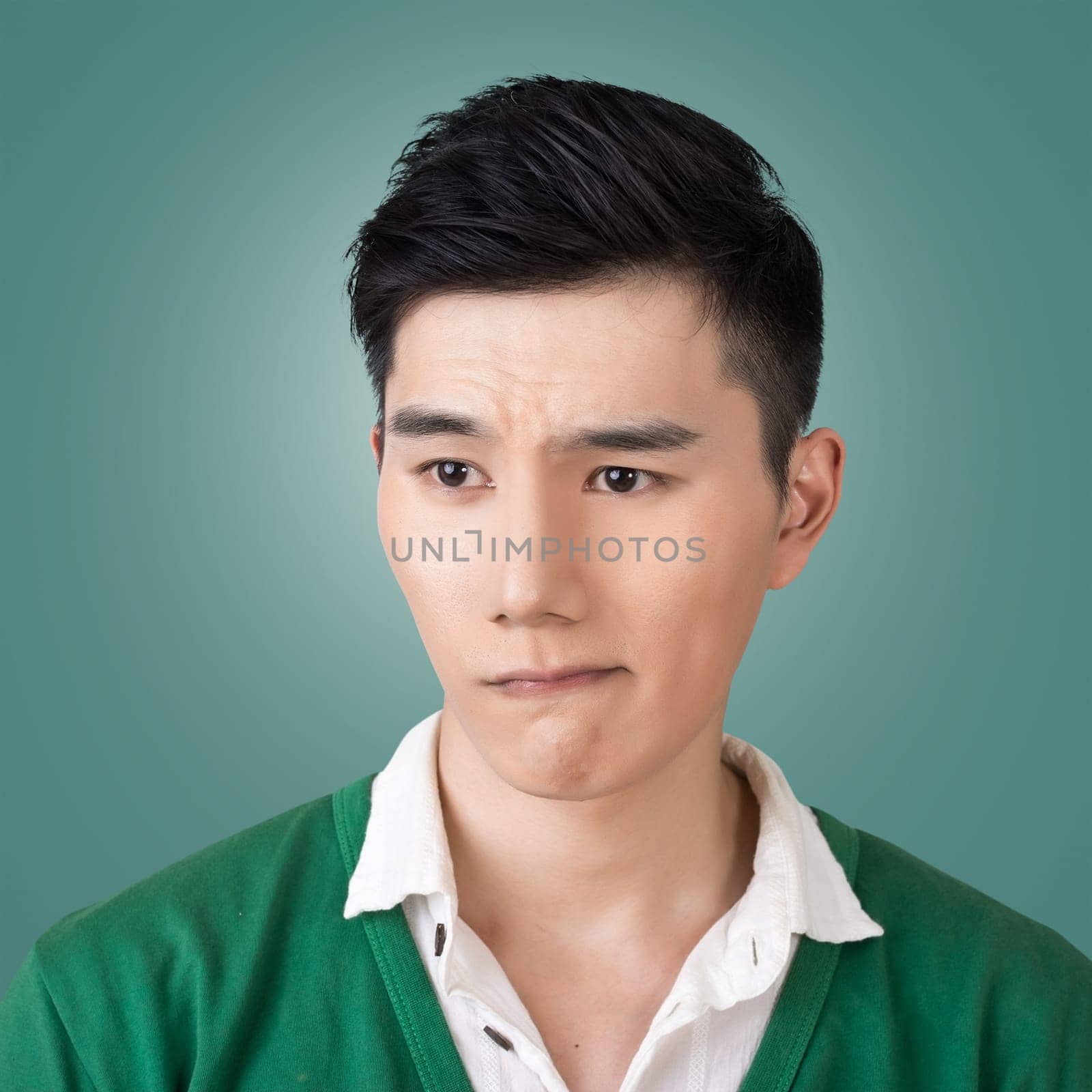 Funny facial expression, closeup Asian young man.