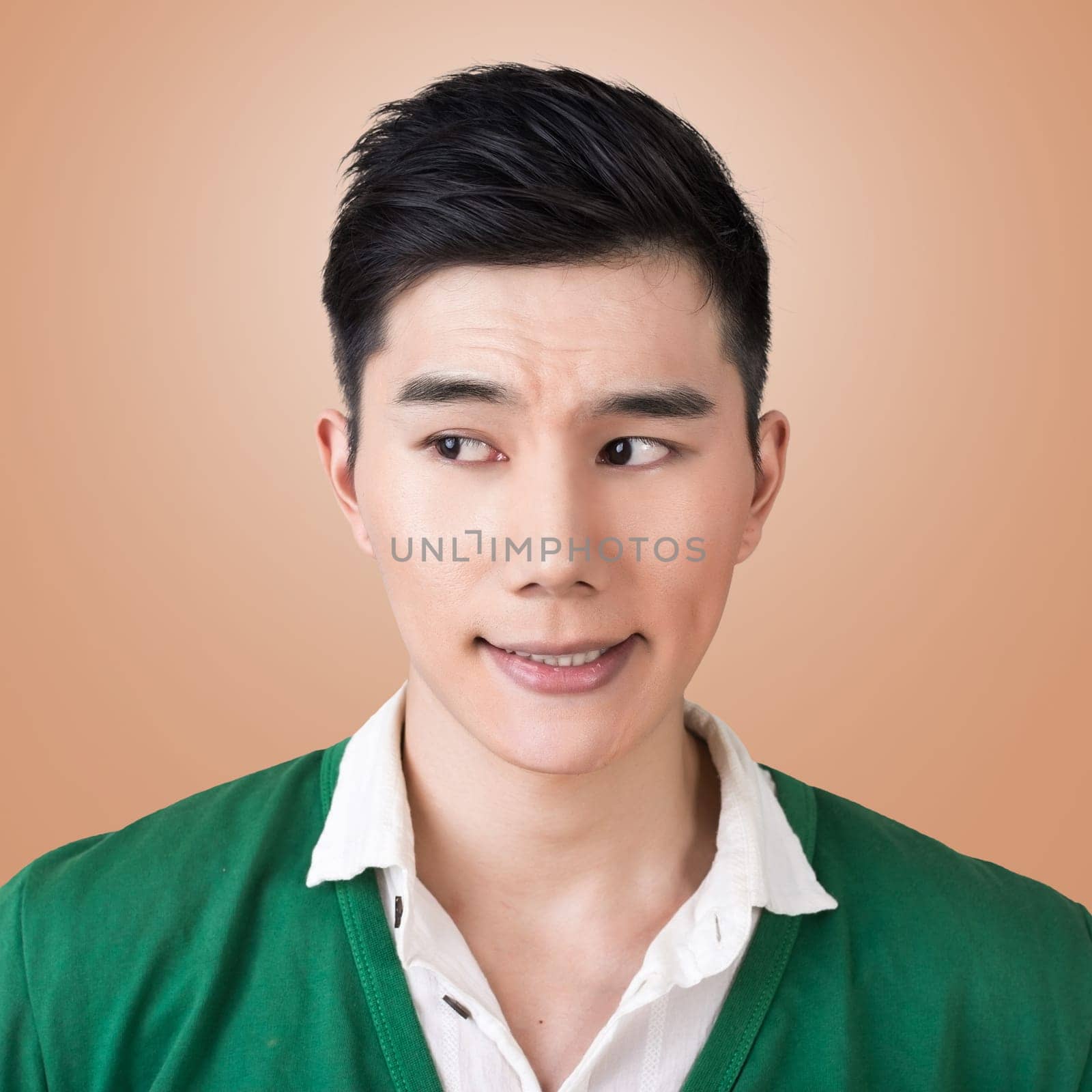 Funny facial expression, closeup Asian young man.