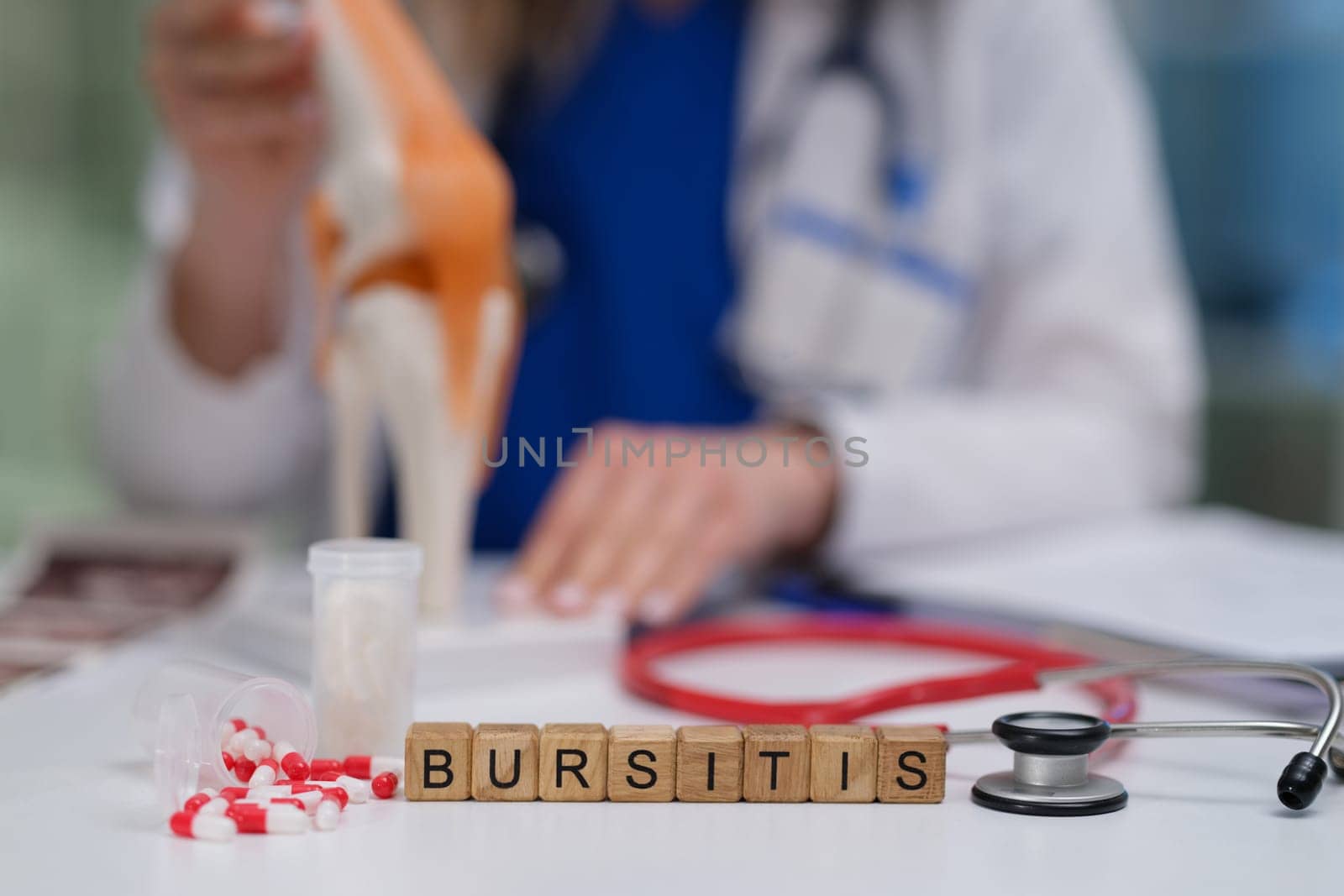 An illustrative medical scene showcasing a bursitis diagnosis, featuring a knee model, stethoscope, and medication