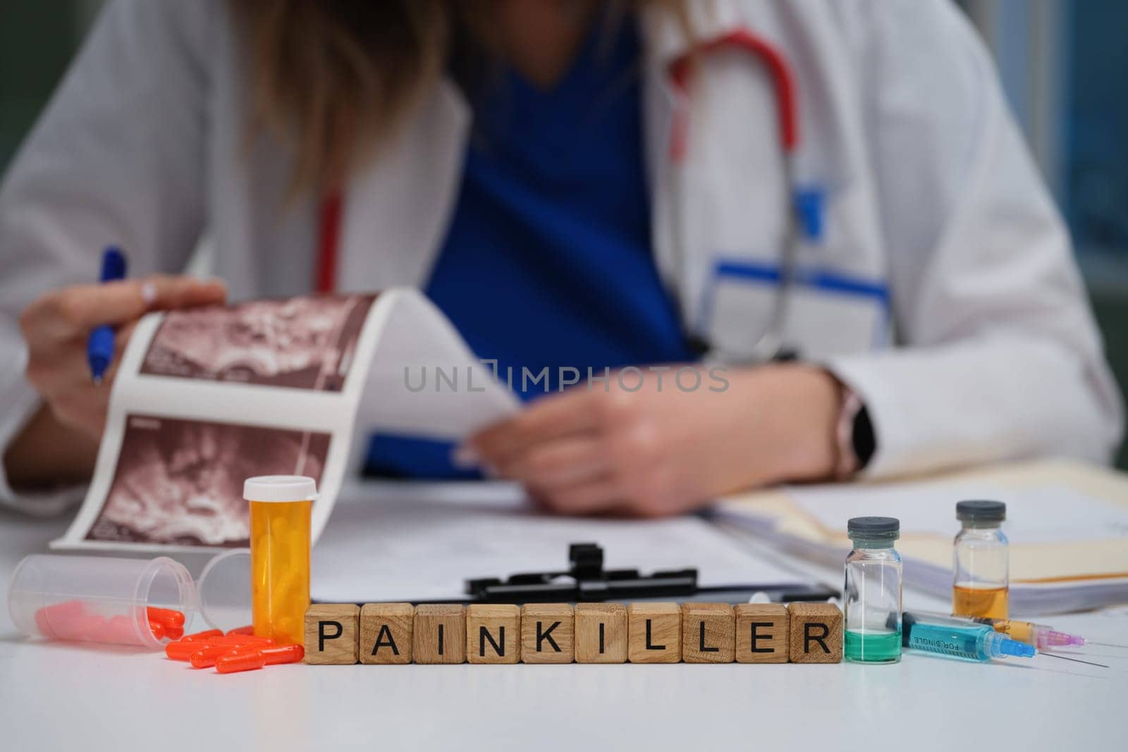 A medical professional reviews a patient report, focusing on the prescribed painkiller for effective management