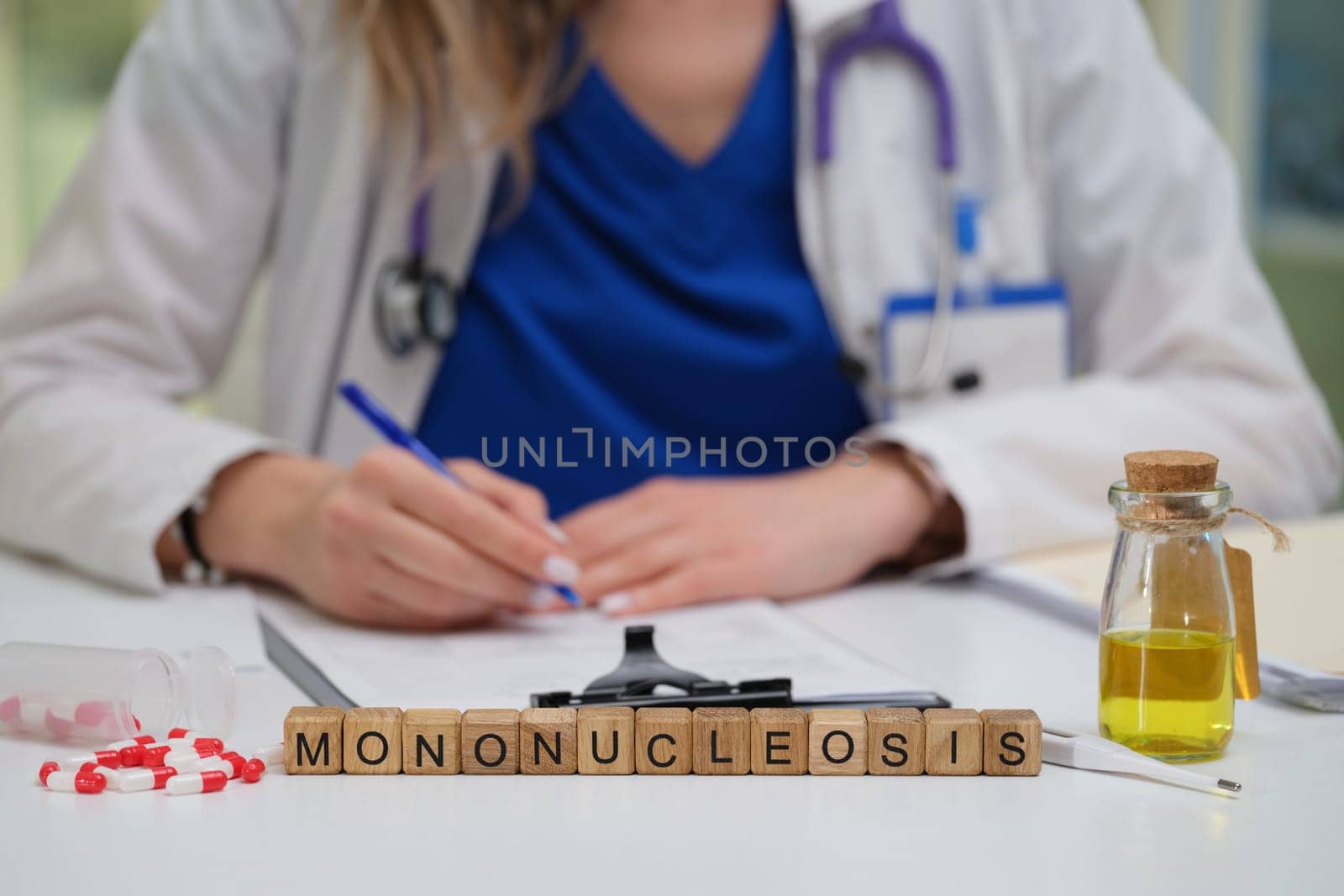 A healthcare professional is documenting insights on mononucleosis and effective patient care strategies