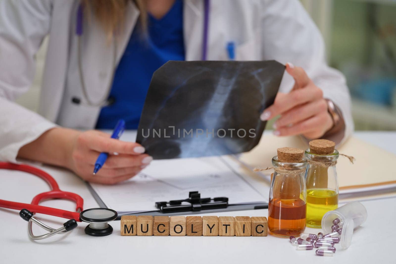 A healthcare professional conducts a detailed evaluation of an Xray while considering various mucolytic options