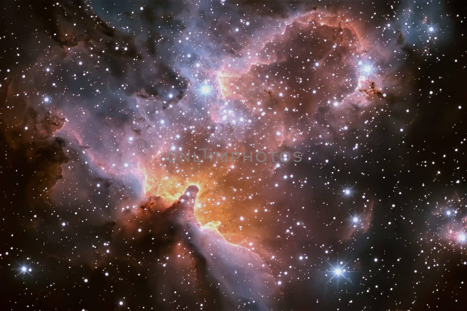 Stunning display of a nebula glowing with vibrant hues, surrounded by a multitude of sparkling stars, captivating all who gaze upon it.
