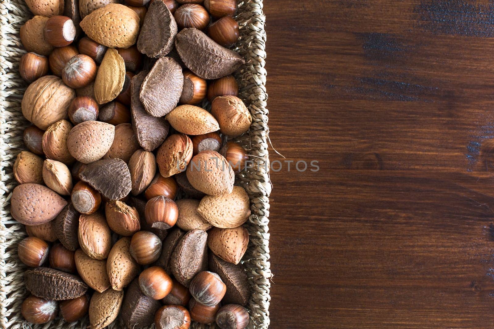 Basket of whole nuts in shell with copy space, can be used vertically or horizontally.