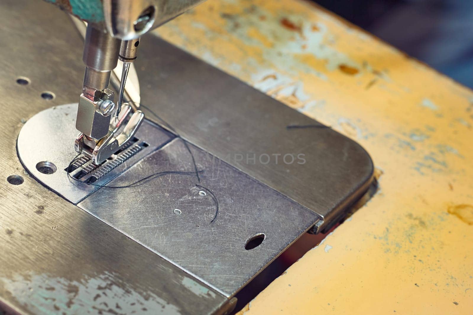 Needle fixing device. the action or activity of sewing. a row of stitches sewn on to clot