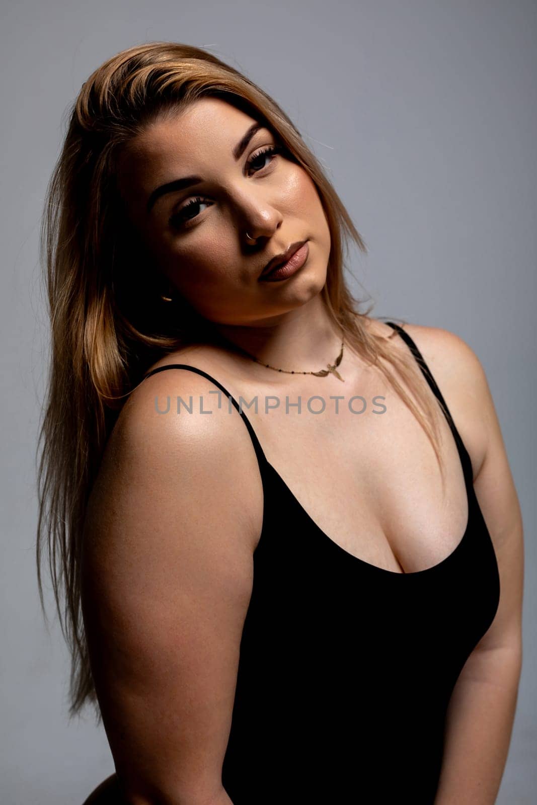 An impressive and striking portrait that captures both confidence and elegance set against a minimalist backdrop