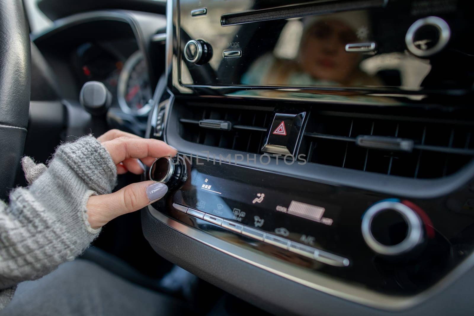 Capturing the special moment of tuning the radio in a modern car to enhance an enjoyable journey experience
