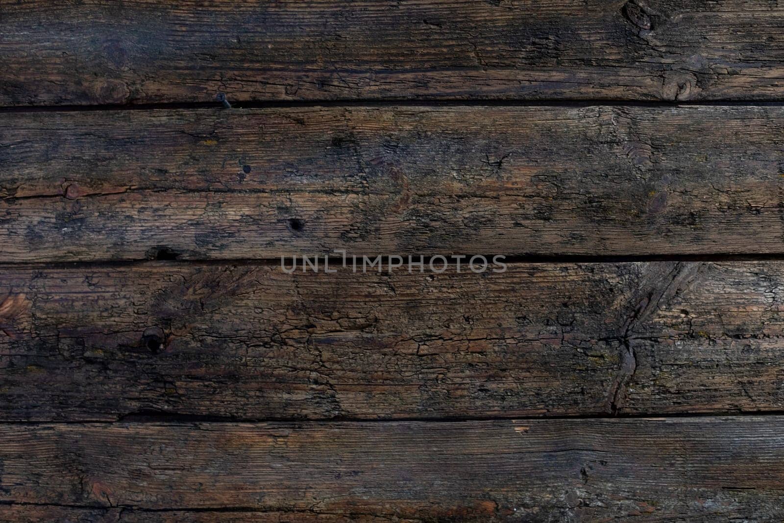 A beautifully textured, dark wooden surface radiating a rustic vibe, making it perfect for design and backgrounds