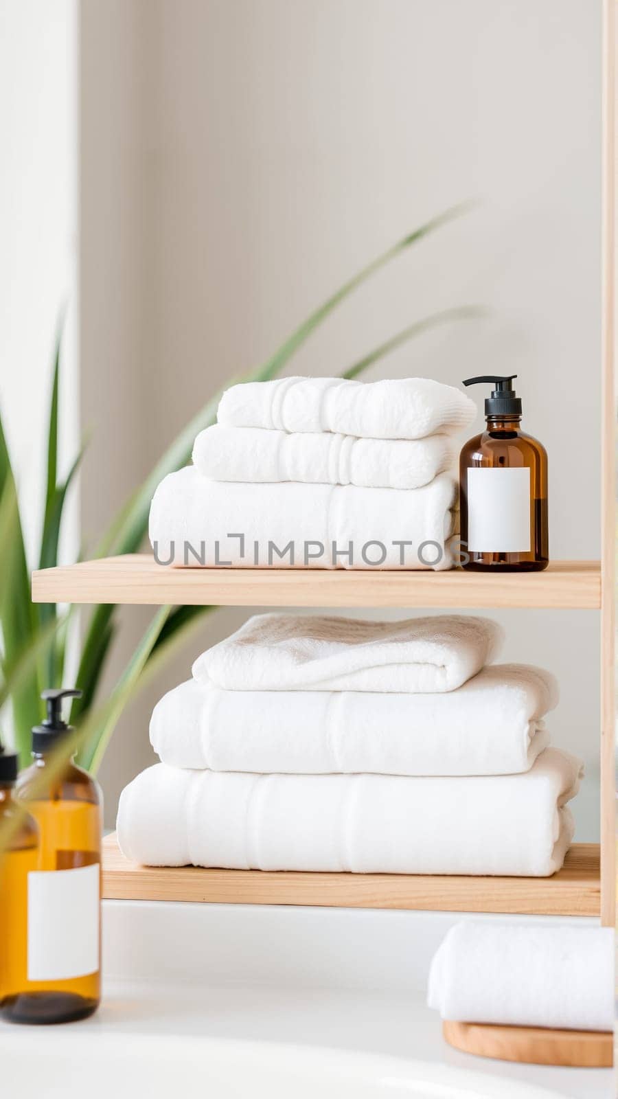 Spa treatment set, wooden shelf with neatly folded towels and dispensers for soap, cream, massage oil. High quality photo