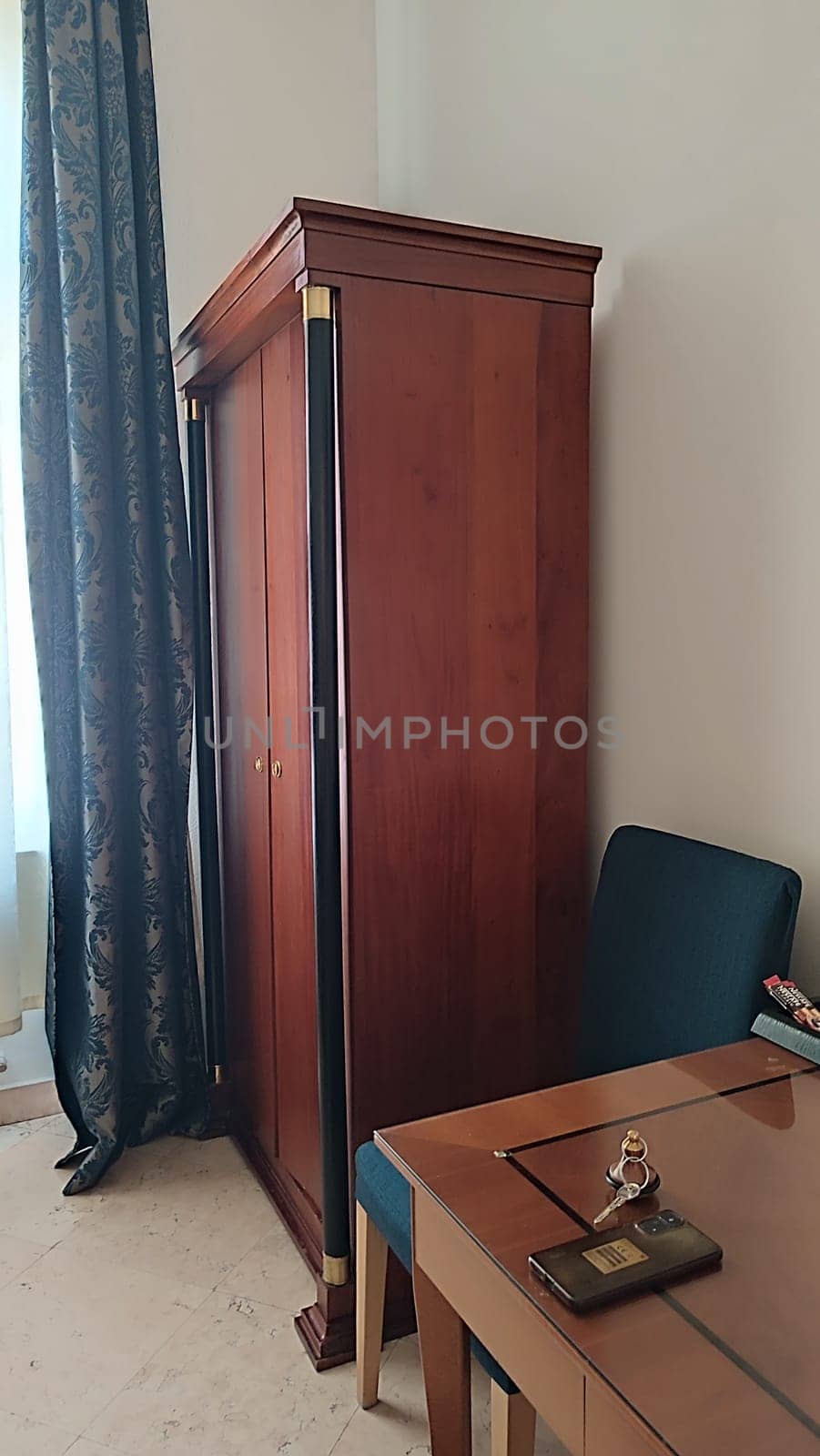 Wooden wardrobe chair table room apartment hotel interior design decor . High quality photo