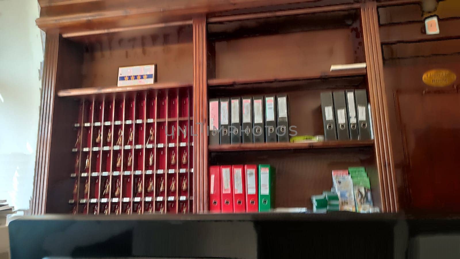 October 15 2024 Prague Czech Republic Europe Reception desk shelves reception hotel apartment wooden office indoor . High quality photo