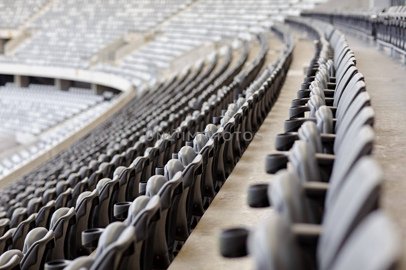 Abstract shot of rows of seating in a sports stadium.