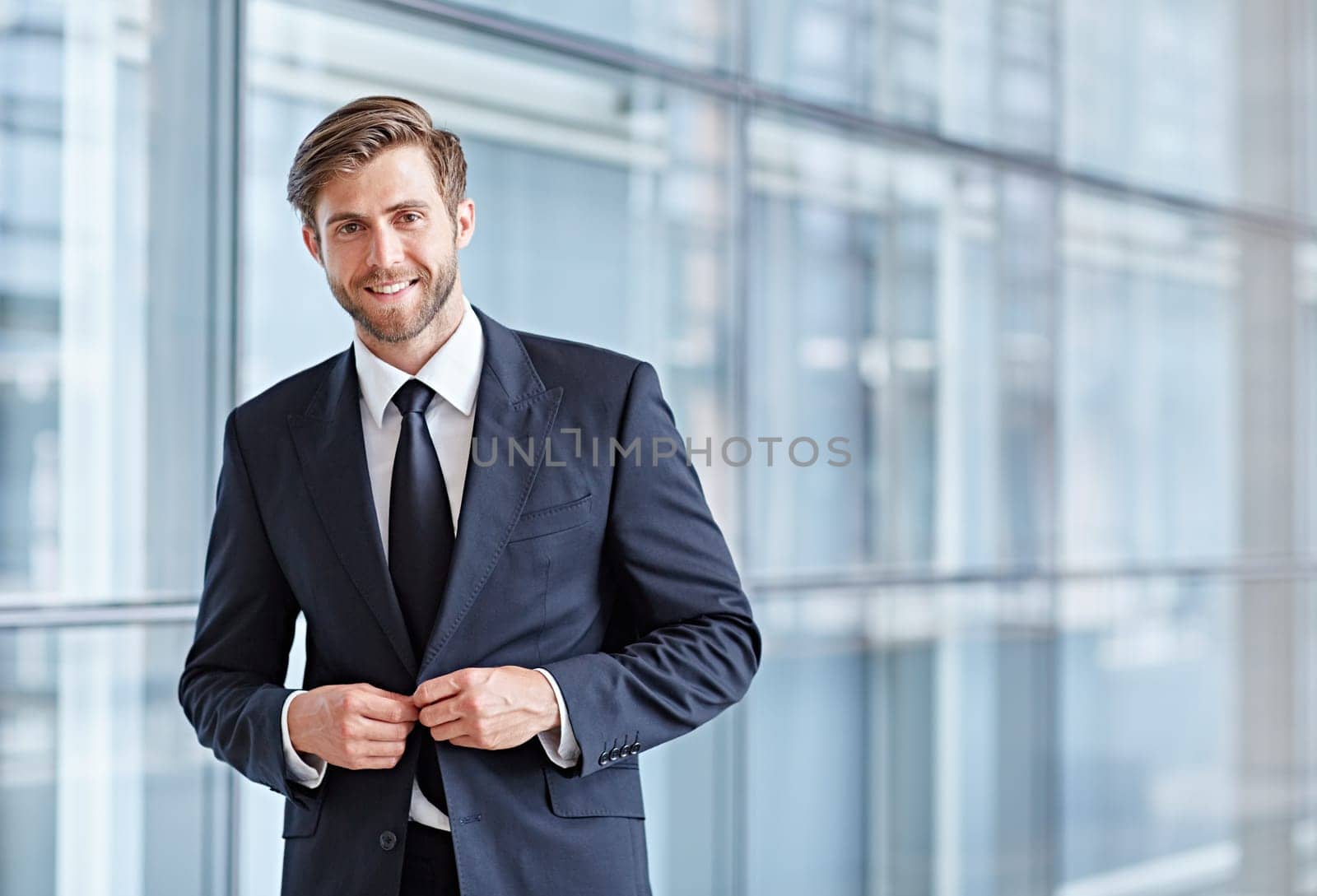 Portrait of a stylish corporate executive smiling confidently at the camera