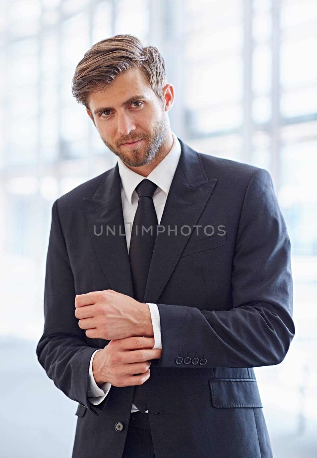 Portrait of a stylish corporate executive smiling confidently at the camera