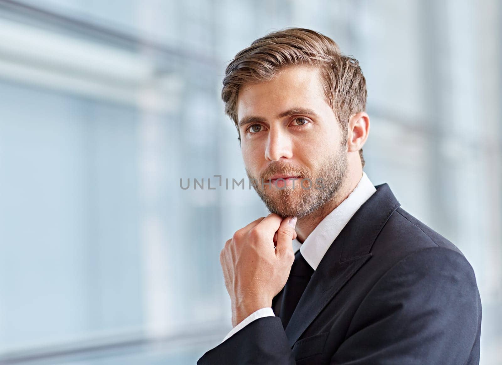 Closeup of a corporate executive looking away thoughtfully and confidently