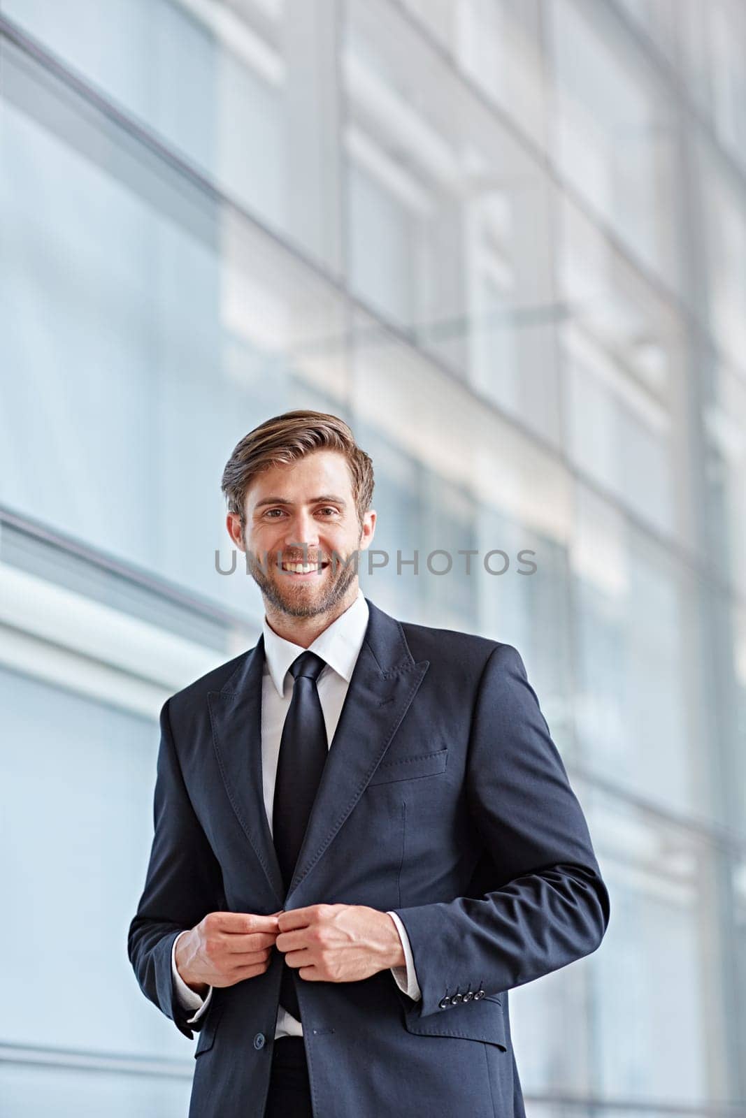 Portrait of a stylish corporate executive smiling confidently at the camera