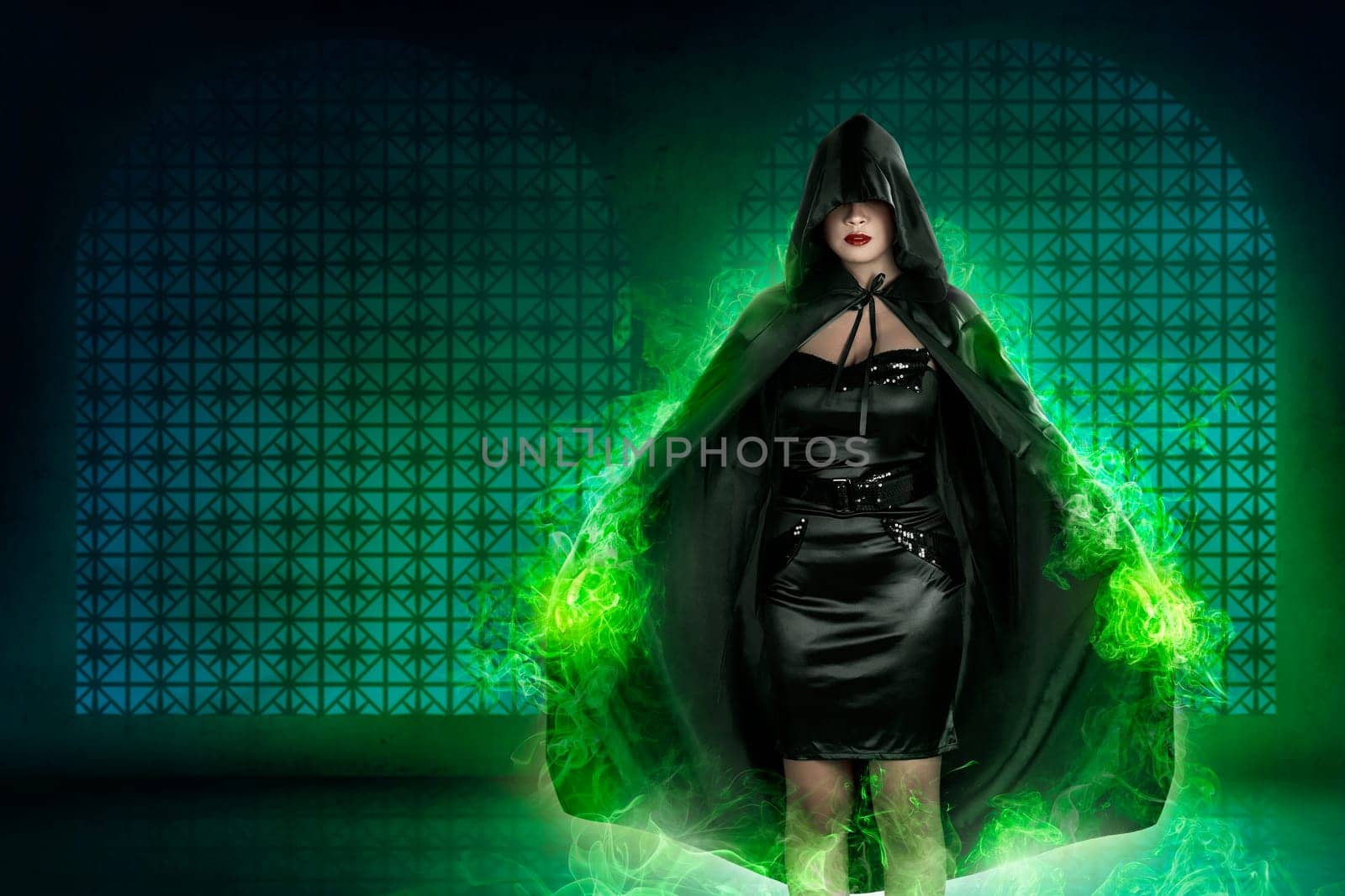 Young asian witch woman with green fog background in empty room