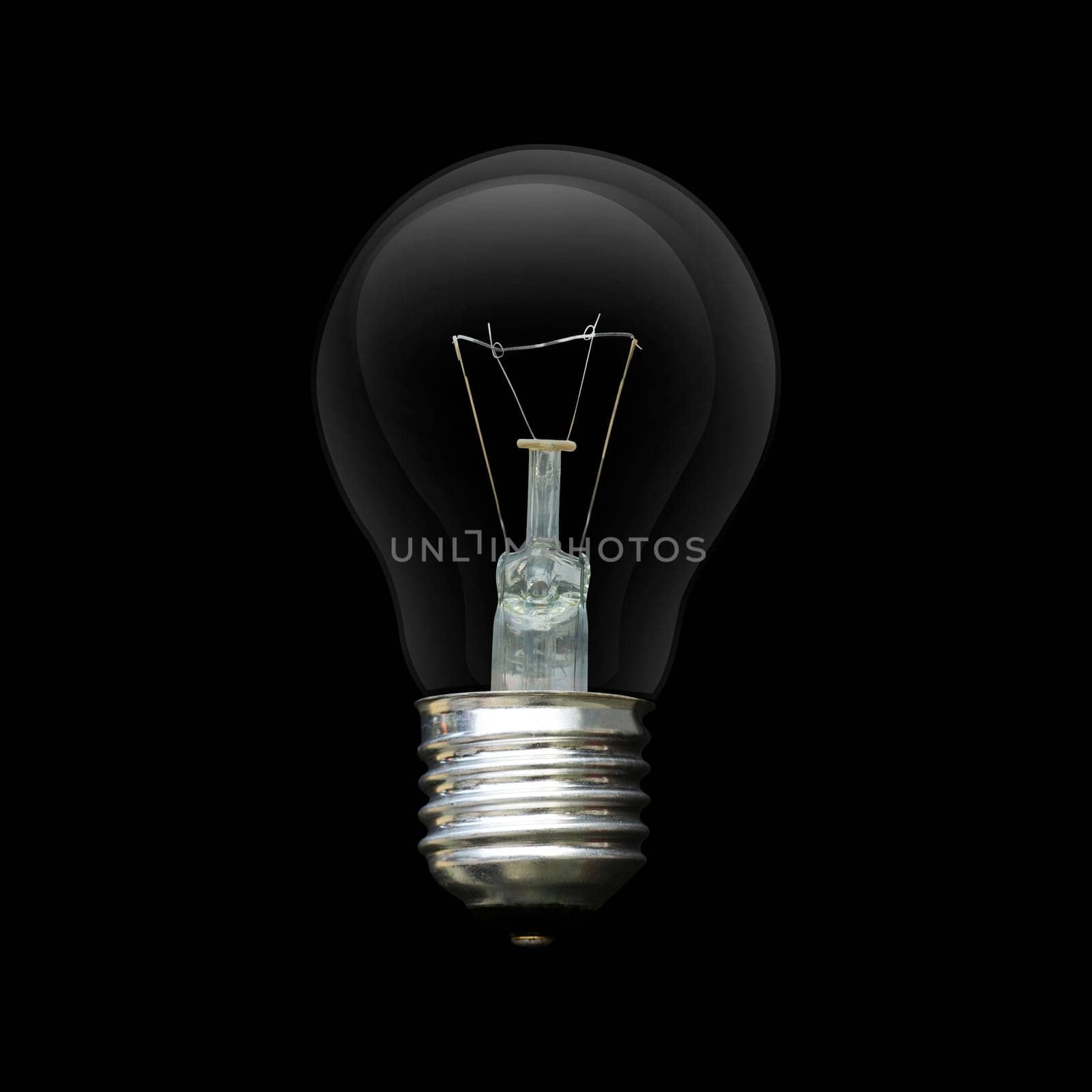 Light bulb isolated on black. Realistic photo image