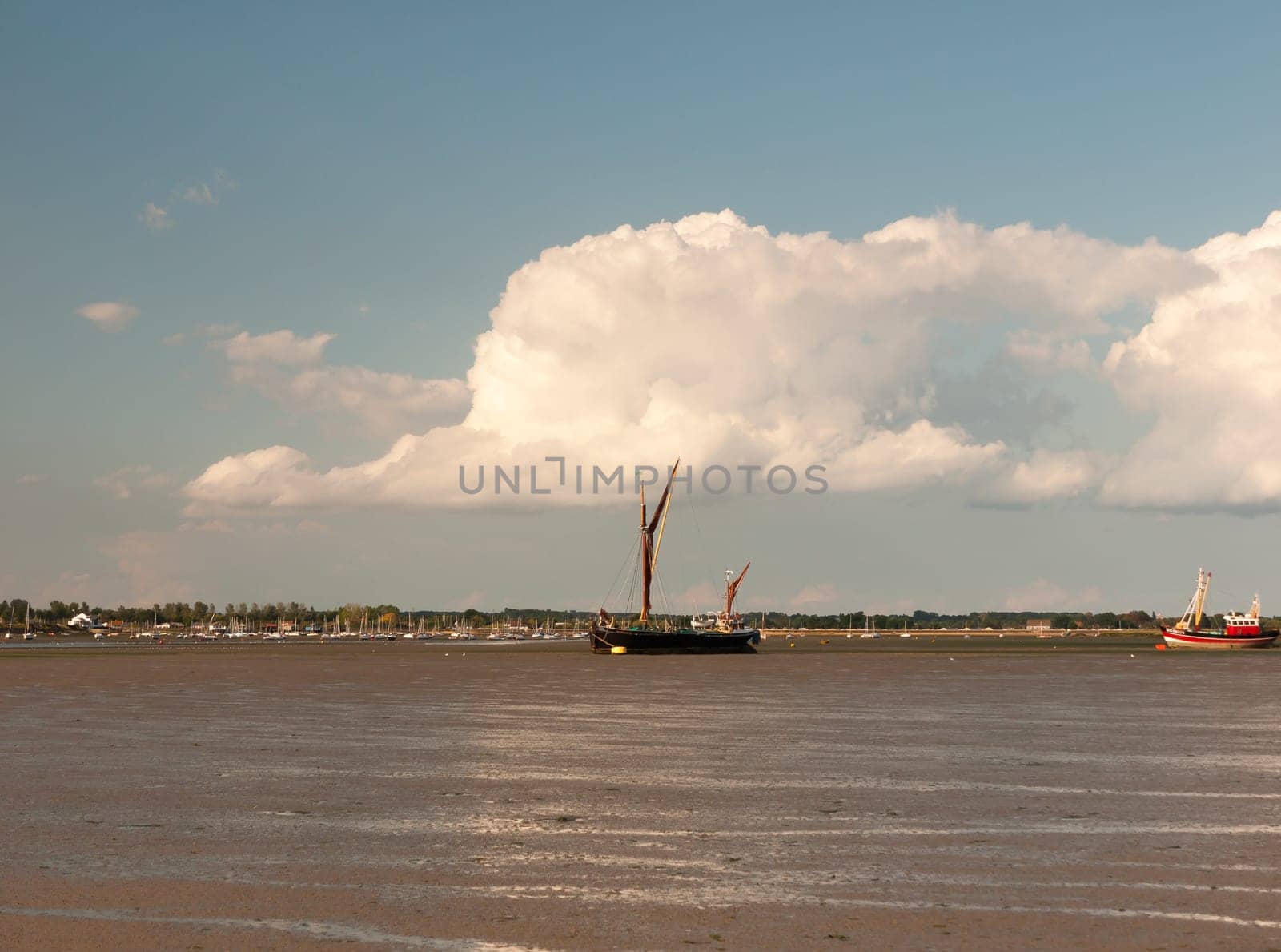 moored sea vessel london barge in black water tide out Maldon Essex  England  UK