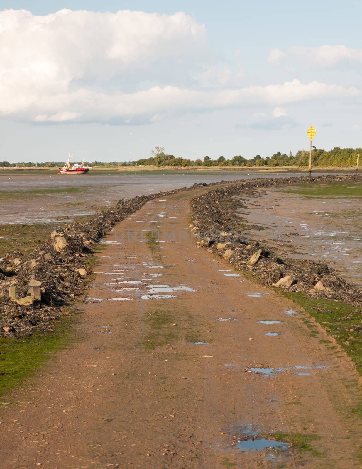road leading onto island with tide out black water Maldon landscape Essex  England  UK