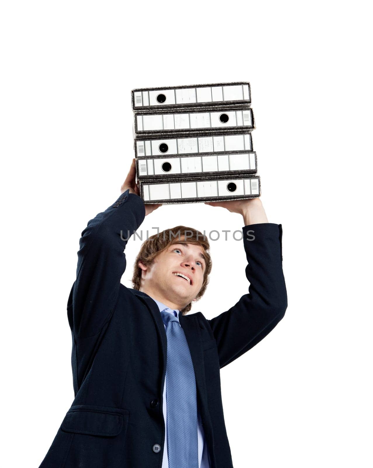 Young business man carrying a bunch of folders