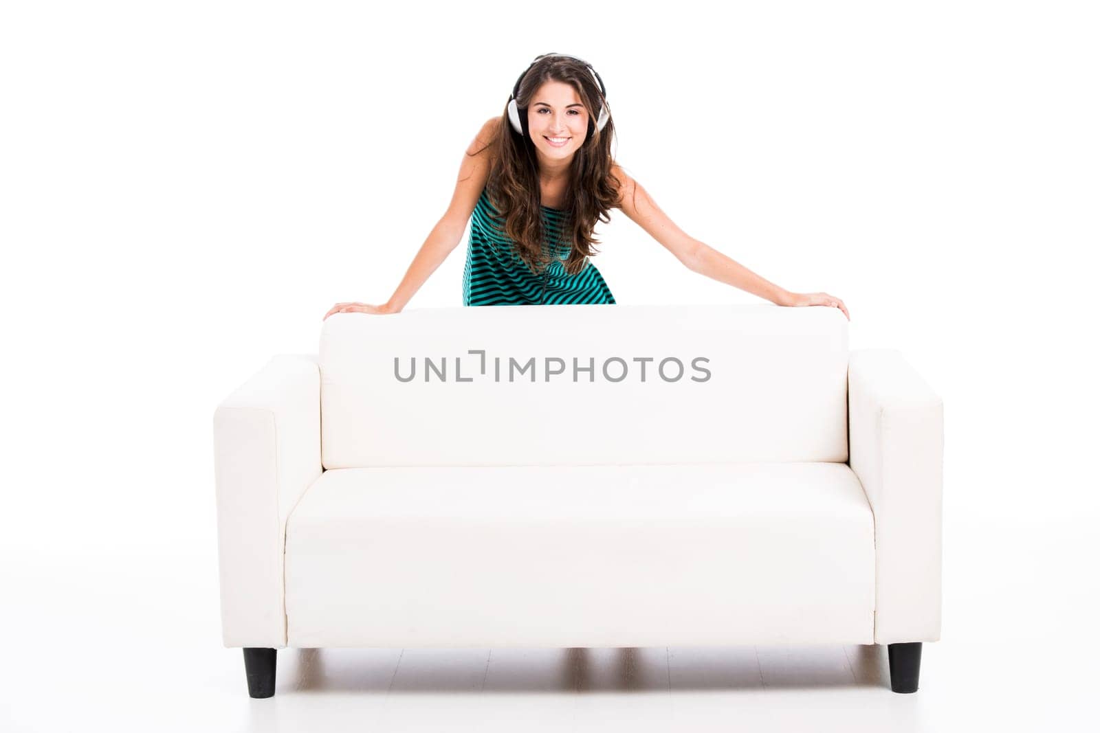 Beautiful woman listen music at home, isolated in white