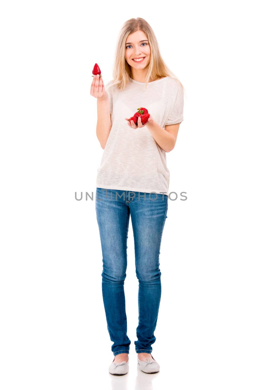 Beautiful blonde woman holding leeks and fighting with them