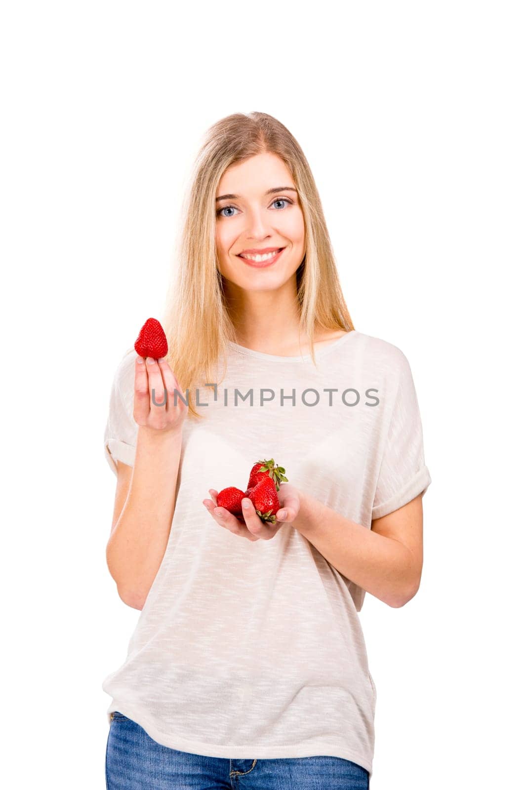 Beautiful blonde woman holding leeks and fighting with them