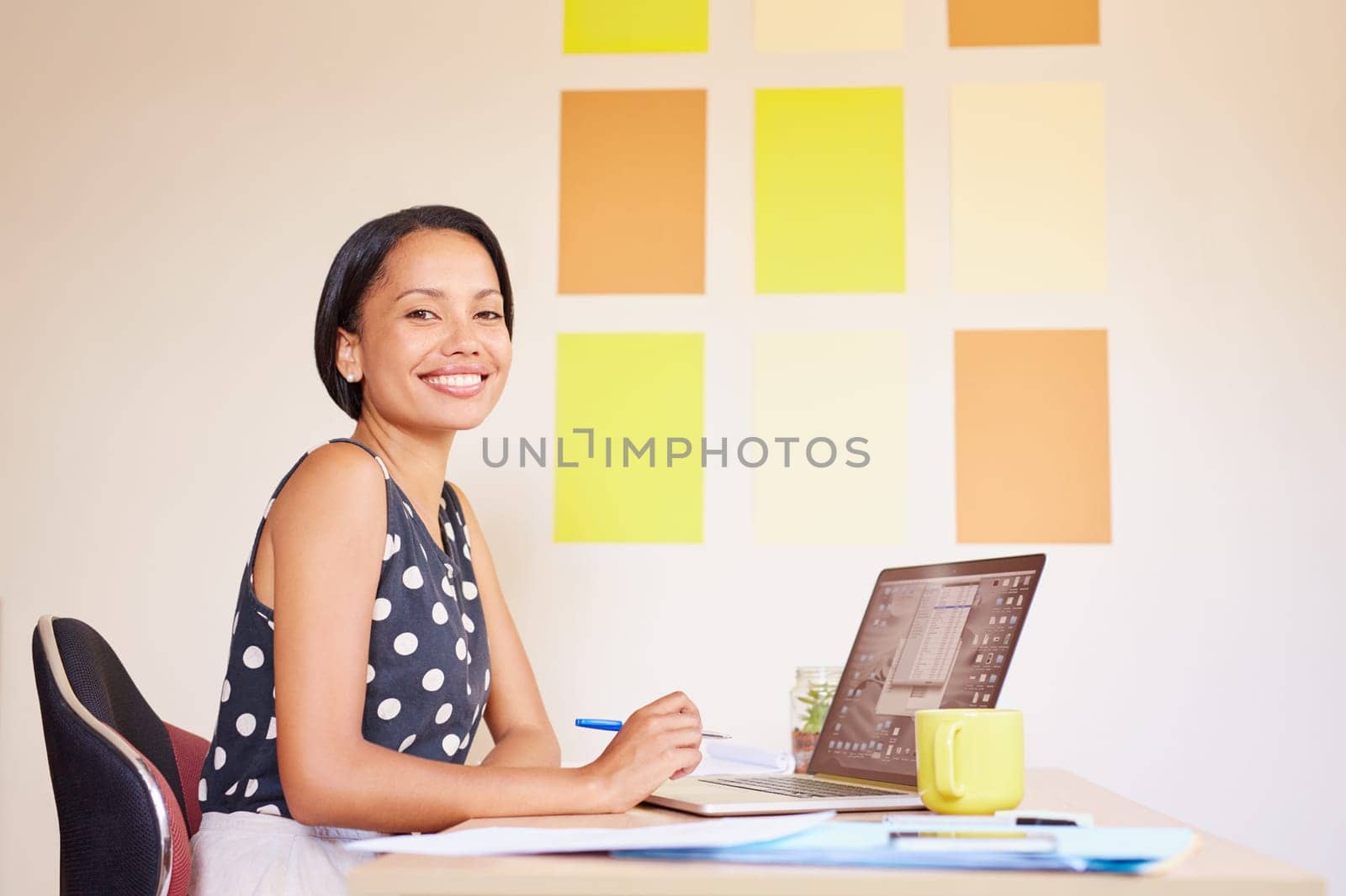 A beautiful young designer smiling at the camera