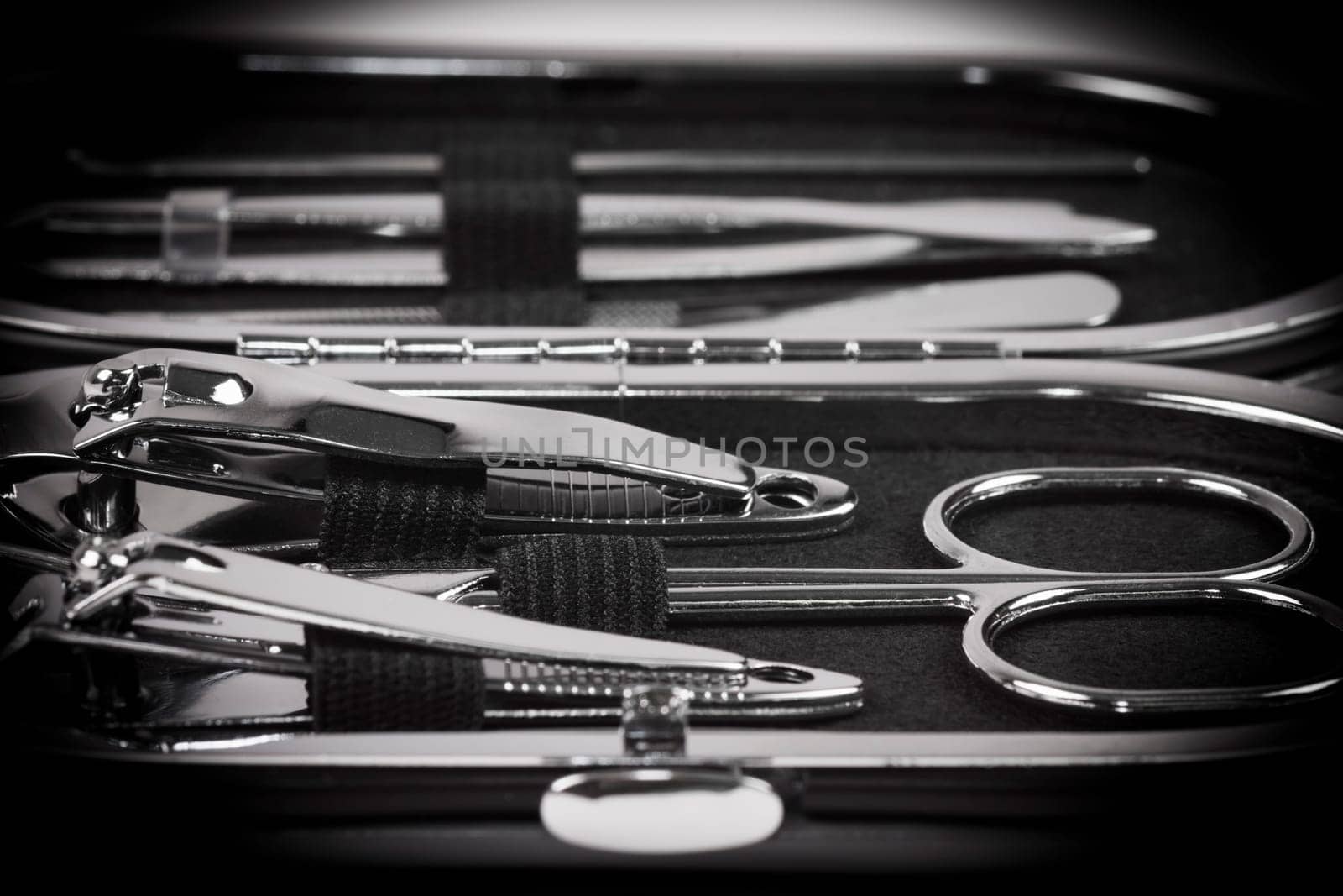 Macro photo about a nail set in own case for nail care.