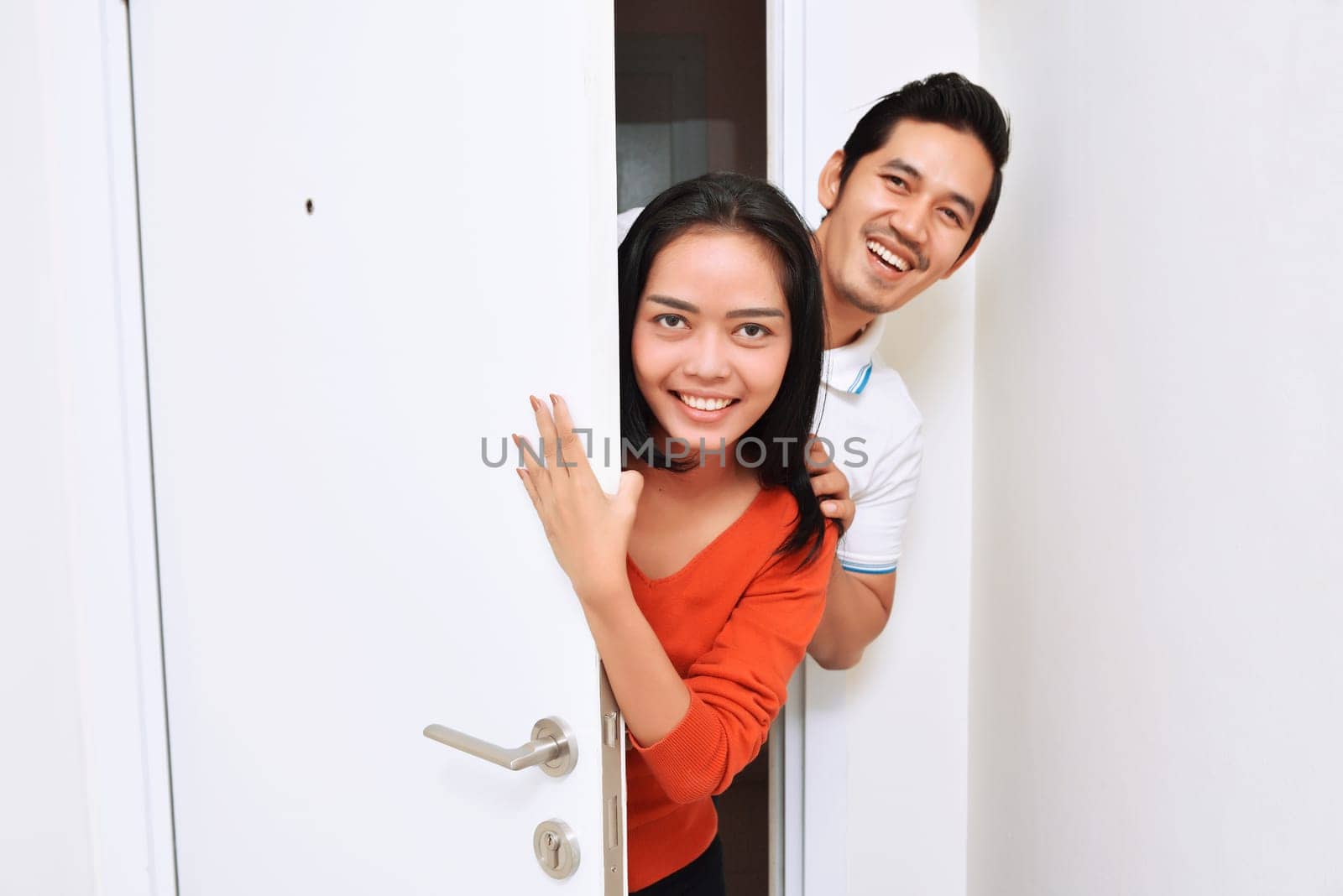 Young asian couple with smile having fun together at home
