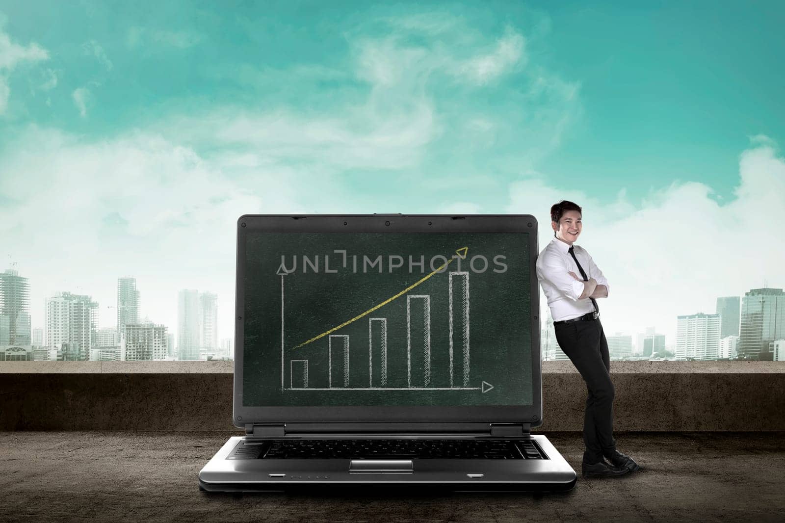 Asian business man leaning on big laptop, show report
