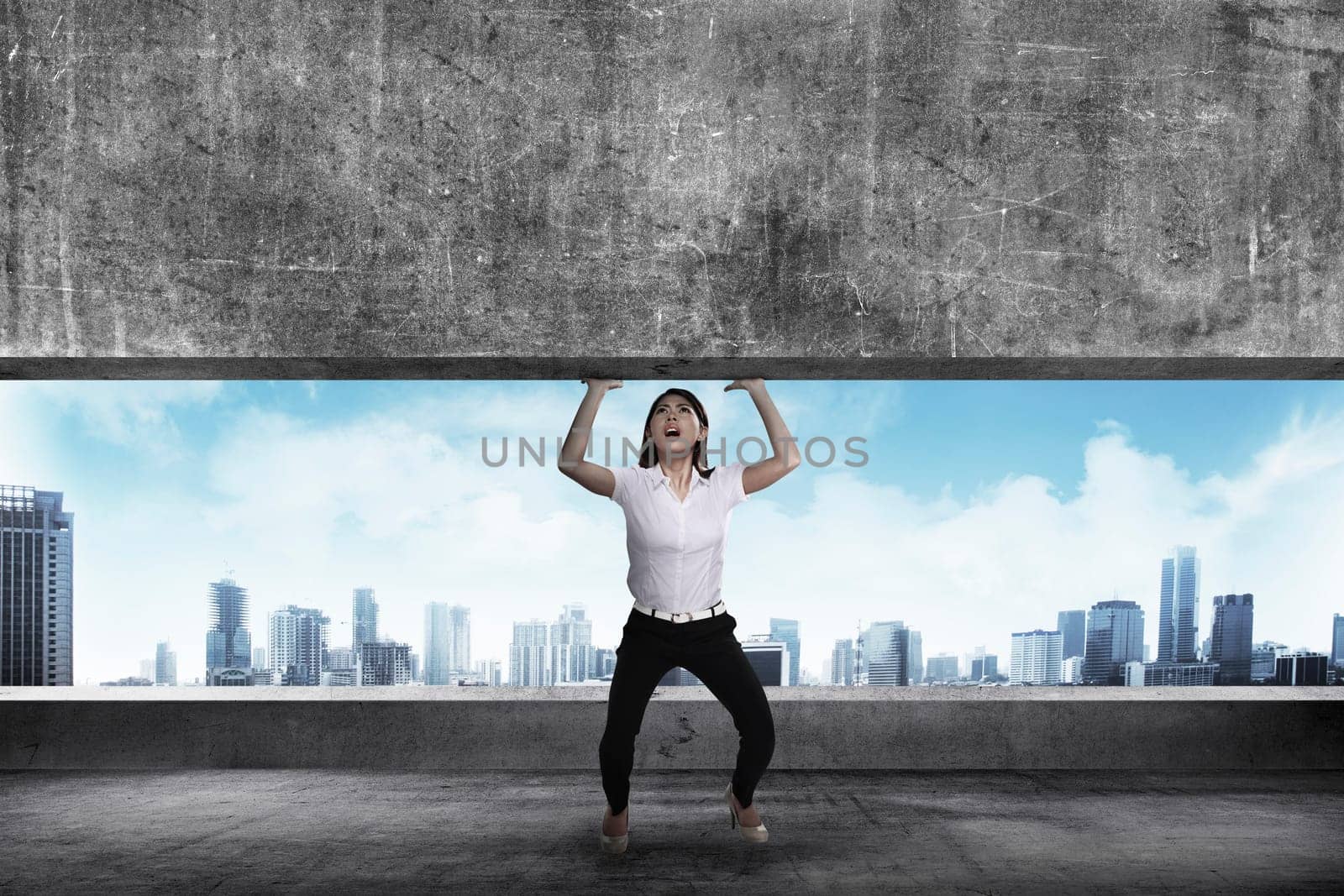 Asian business woman lift heavy block. Business challenge concept