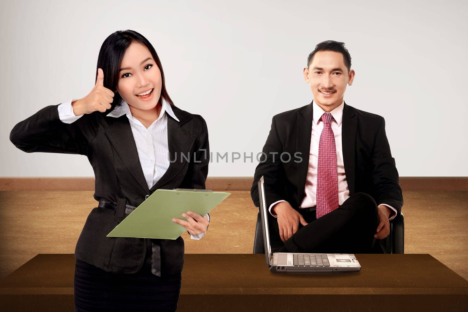 Boss and secretary posing. Business team concept