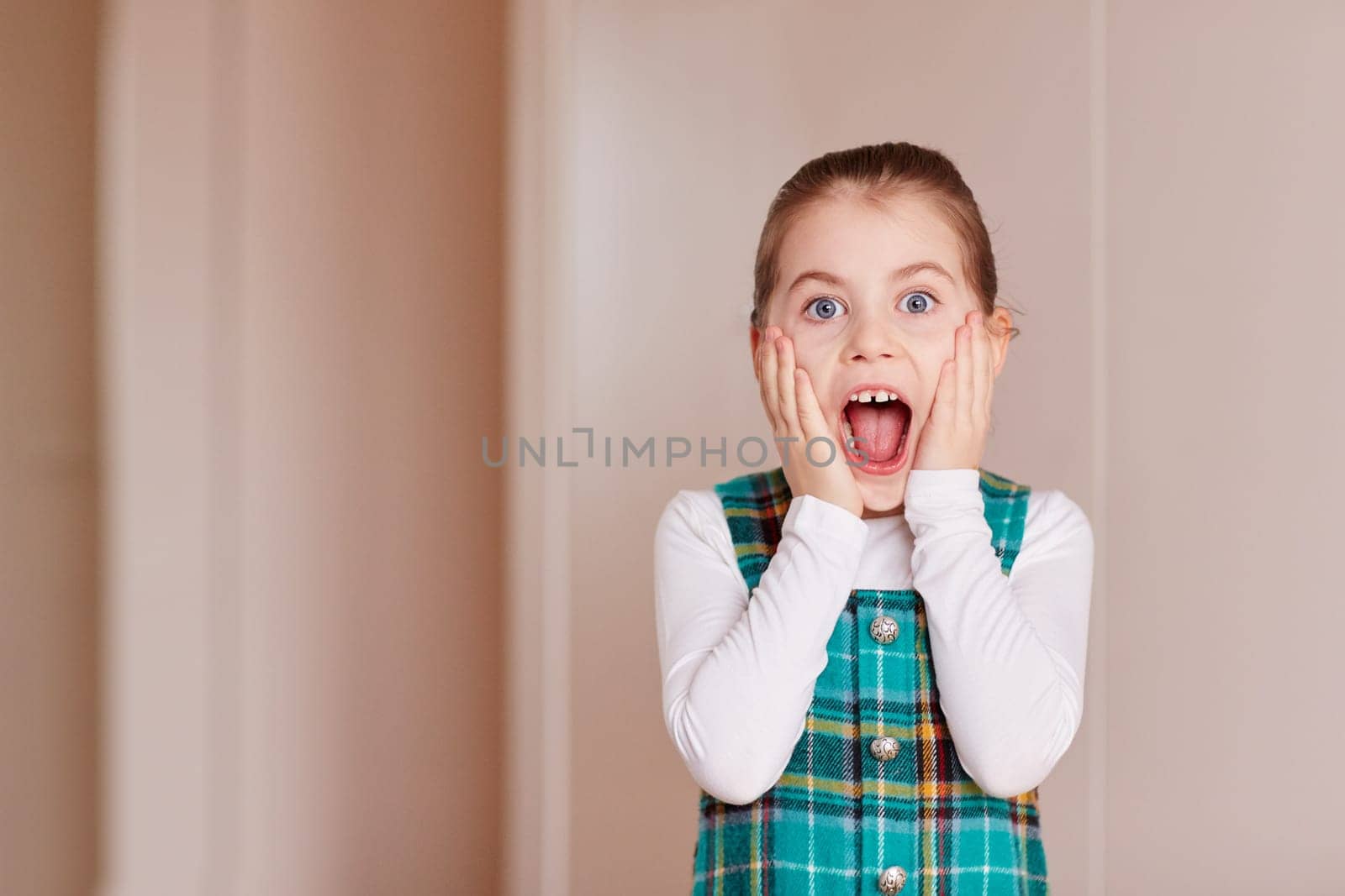 A cute little girl gasping
