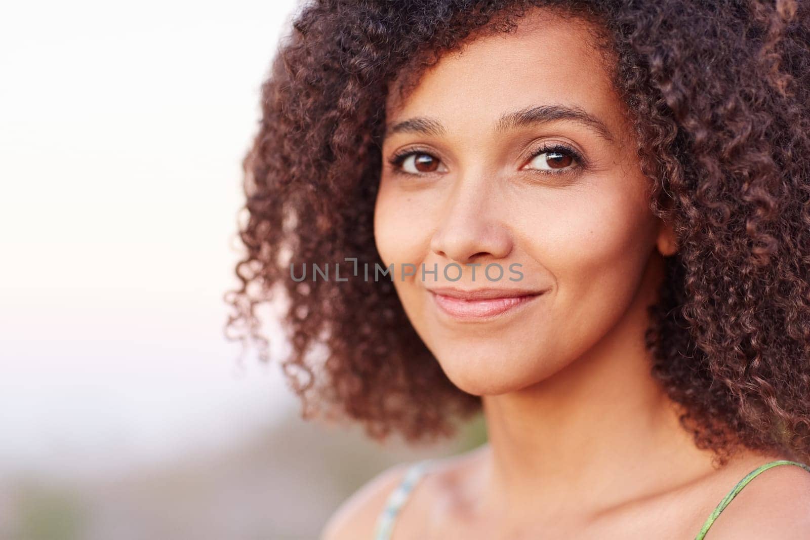 Closeup of a beautiful young woman outdoors