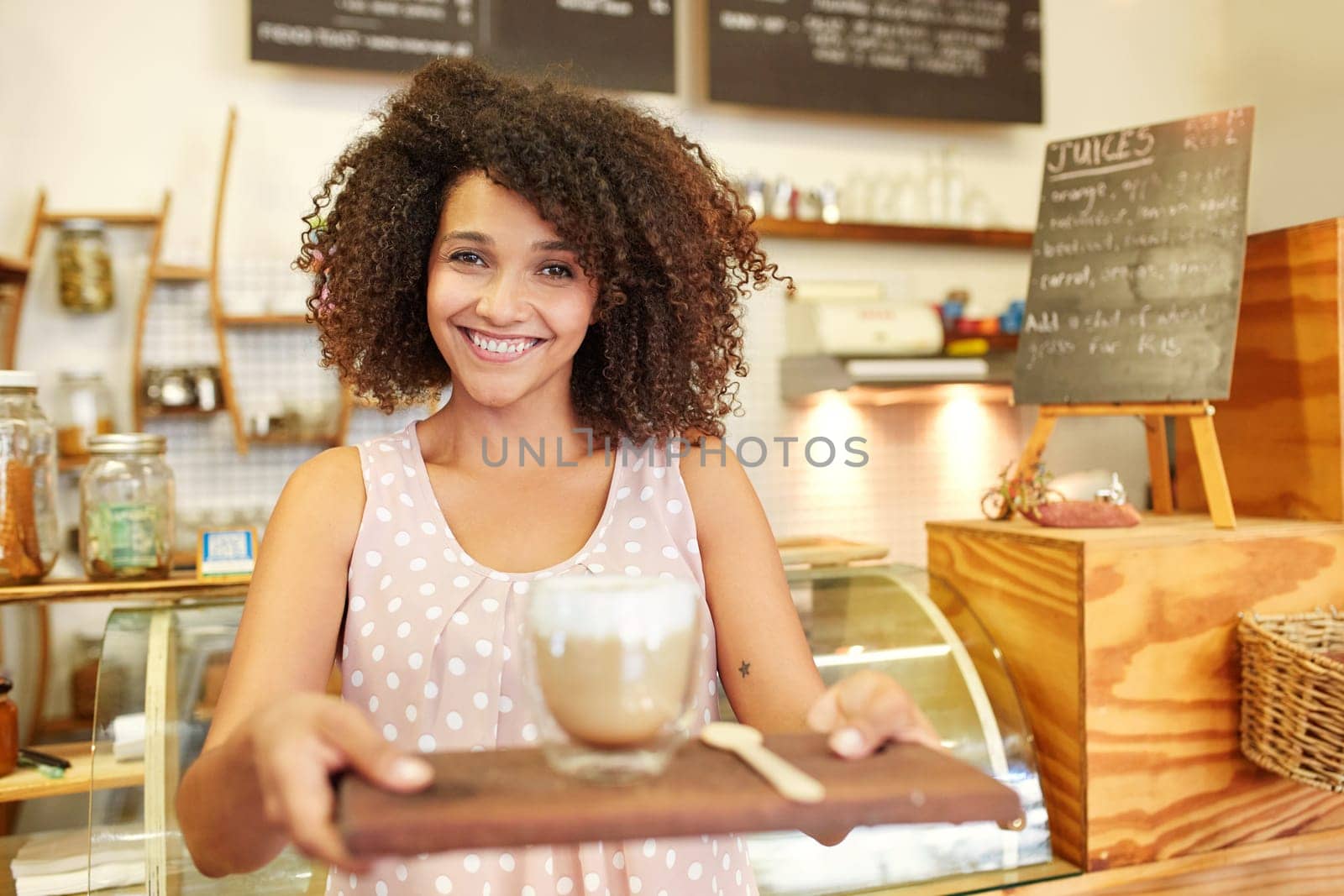 A young waitress bring you a cup of coffee