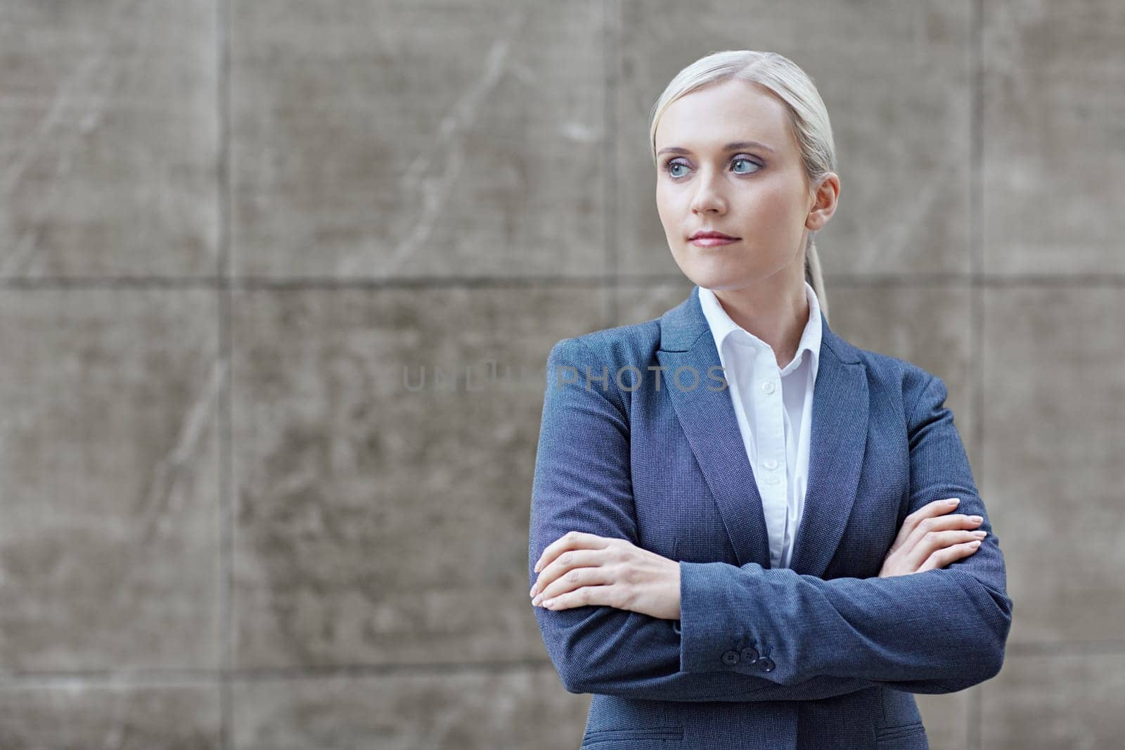 A young businesswoman with her arms folded