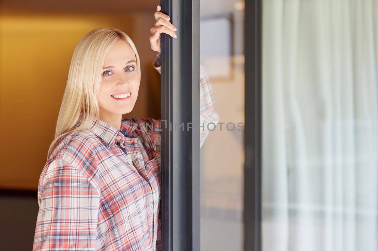 A beautiful young woman in her pyjamas at home