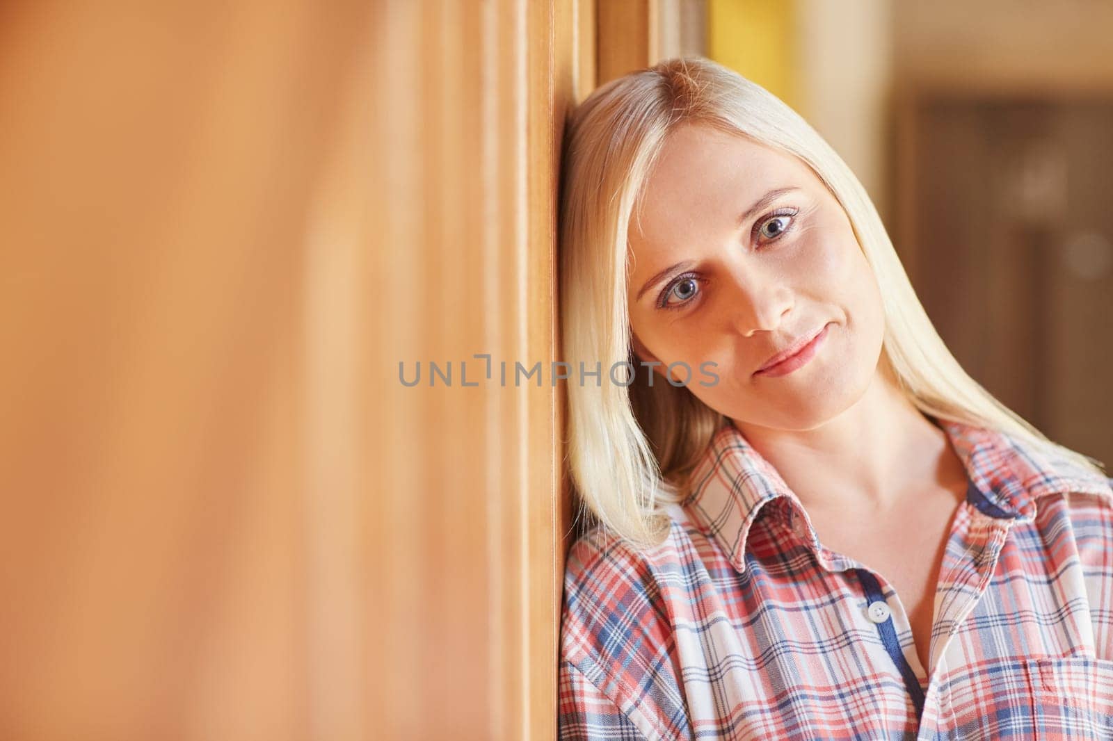 A beautiful young woman in her pyjamas at home