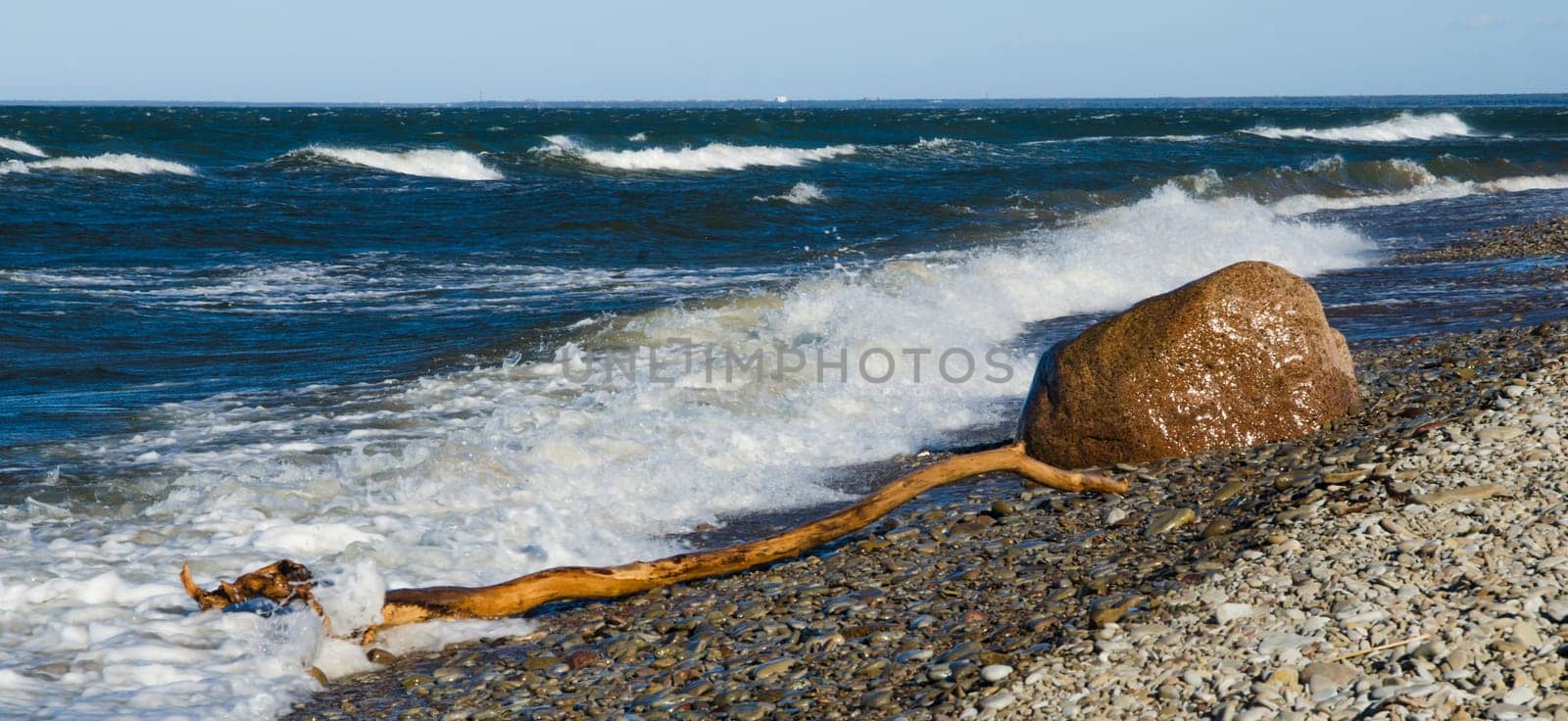 Sea waves lapping on the shore. Baltic Sea.