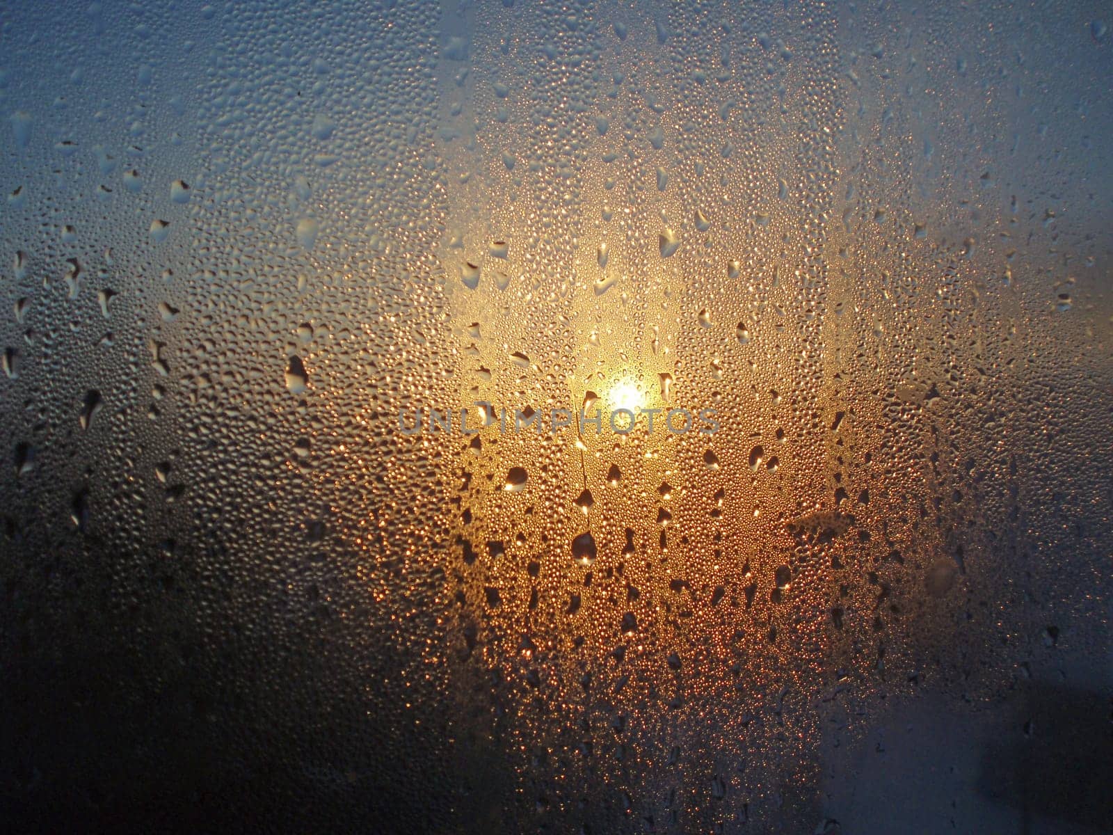 View of sunset trough frosted wondow