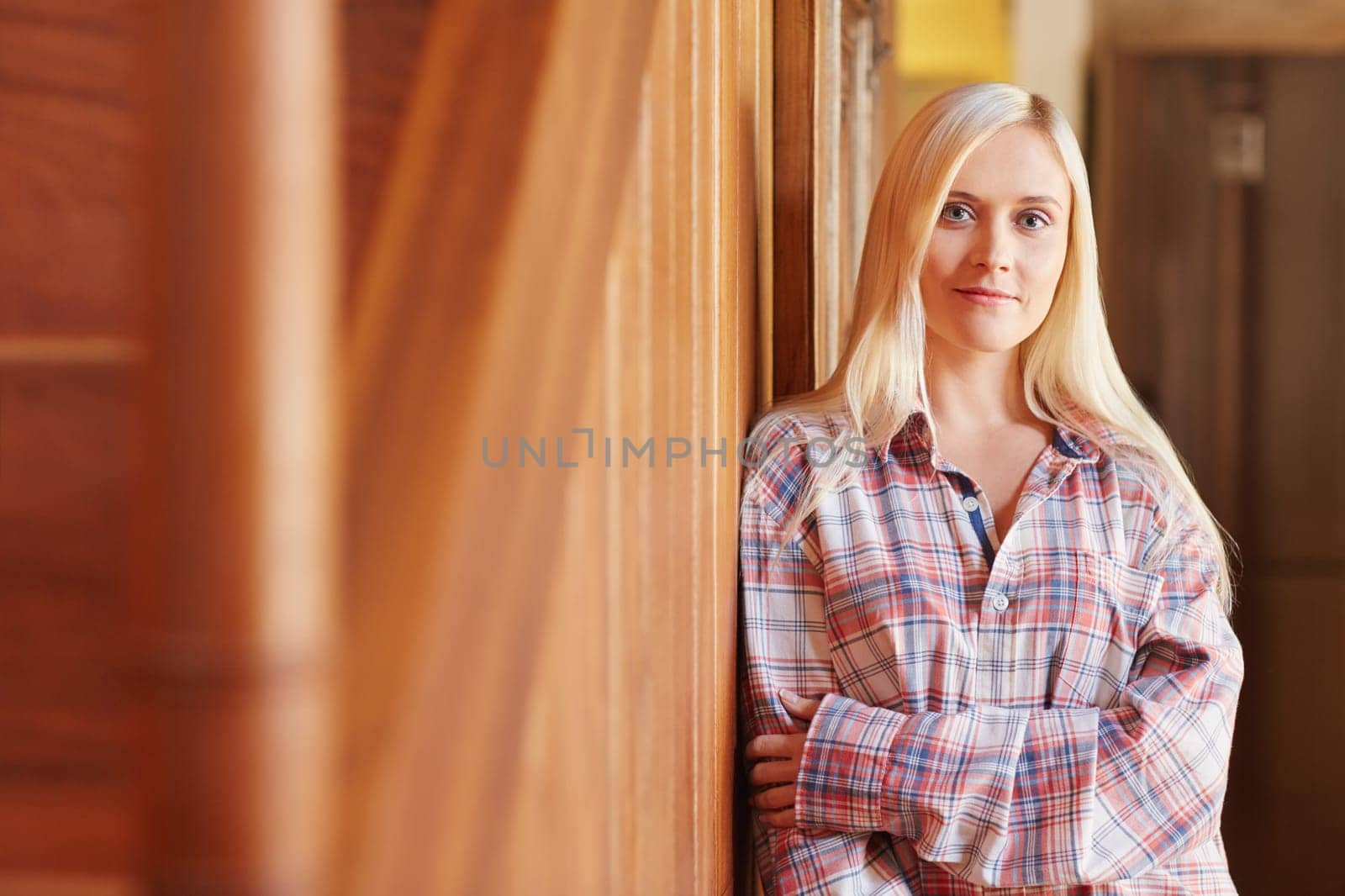 A beautiful young woman in her pyjamas at home