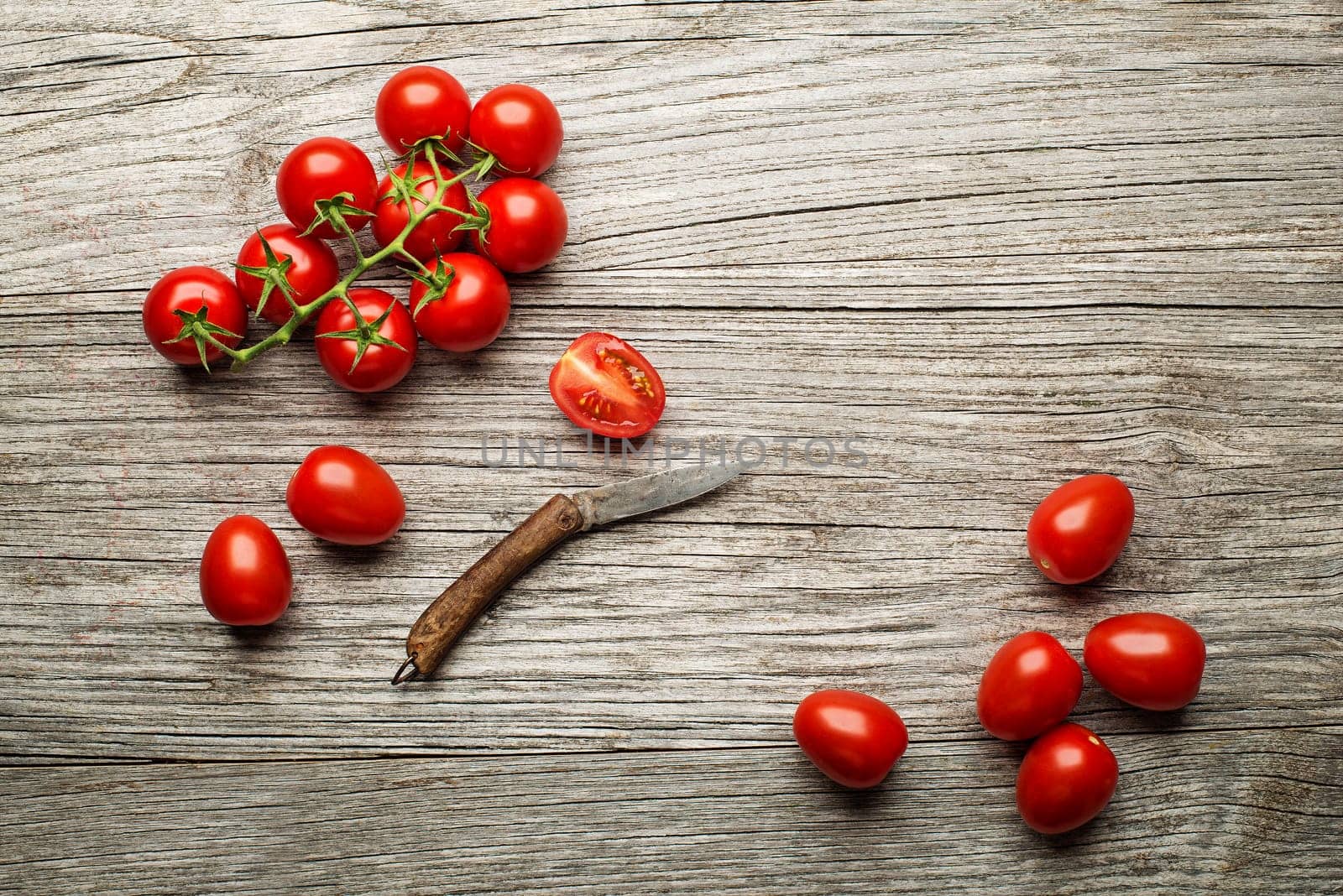 Fresh tomatoes on wooden background. Top view