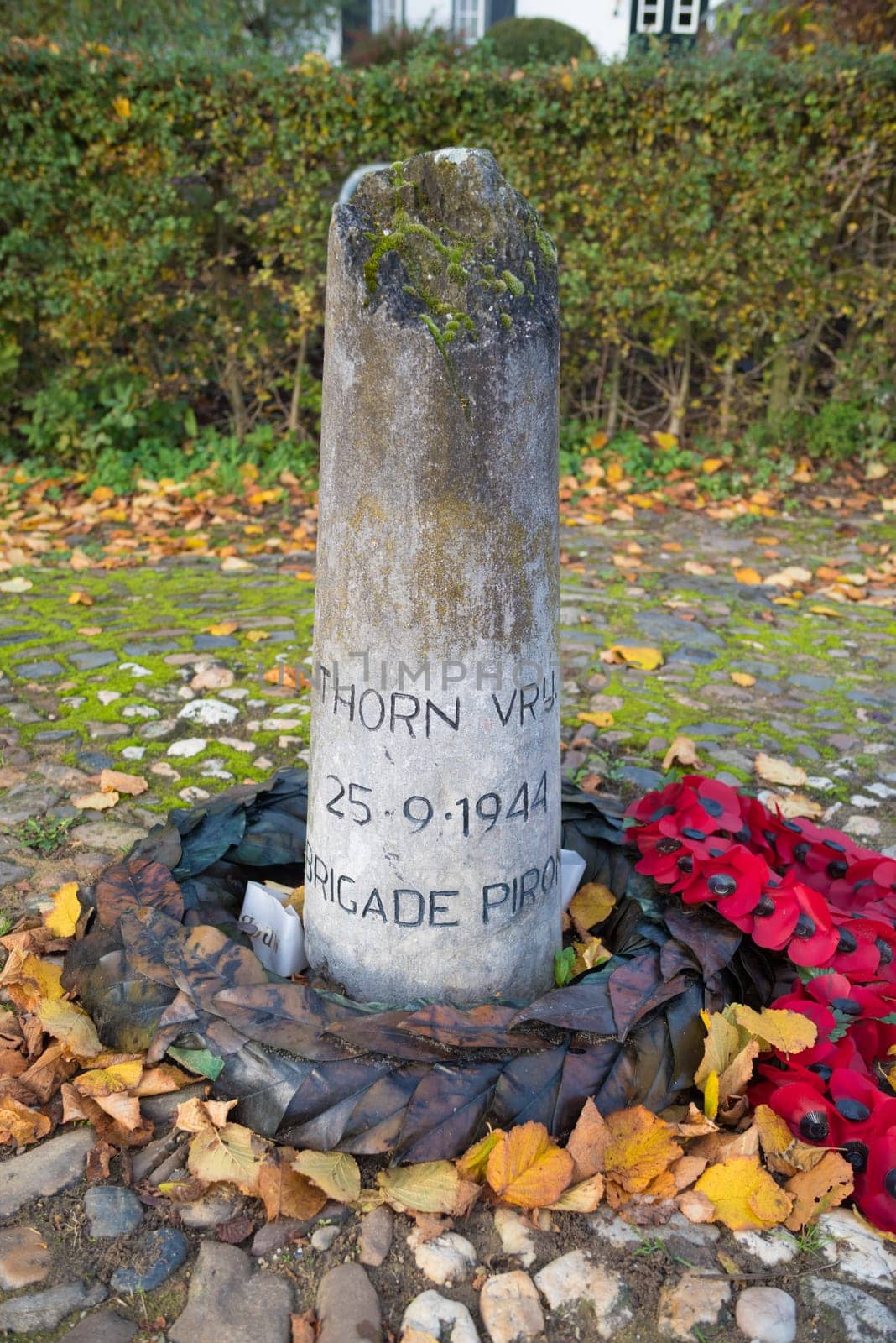 war memorial stone in Thorn, a small village in the southern netherlands, saying "Thorn free""."