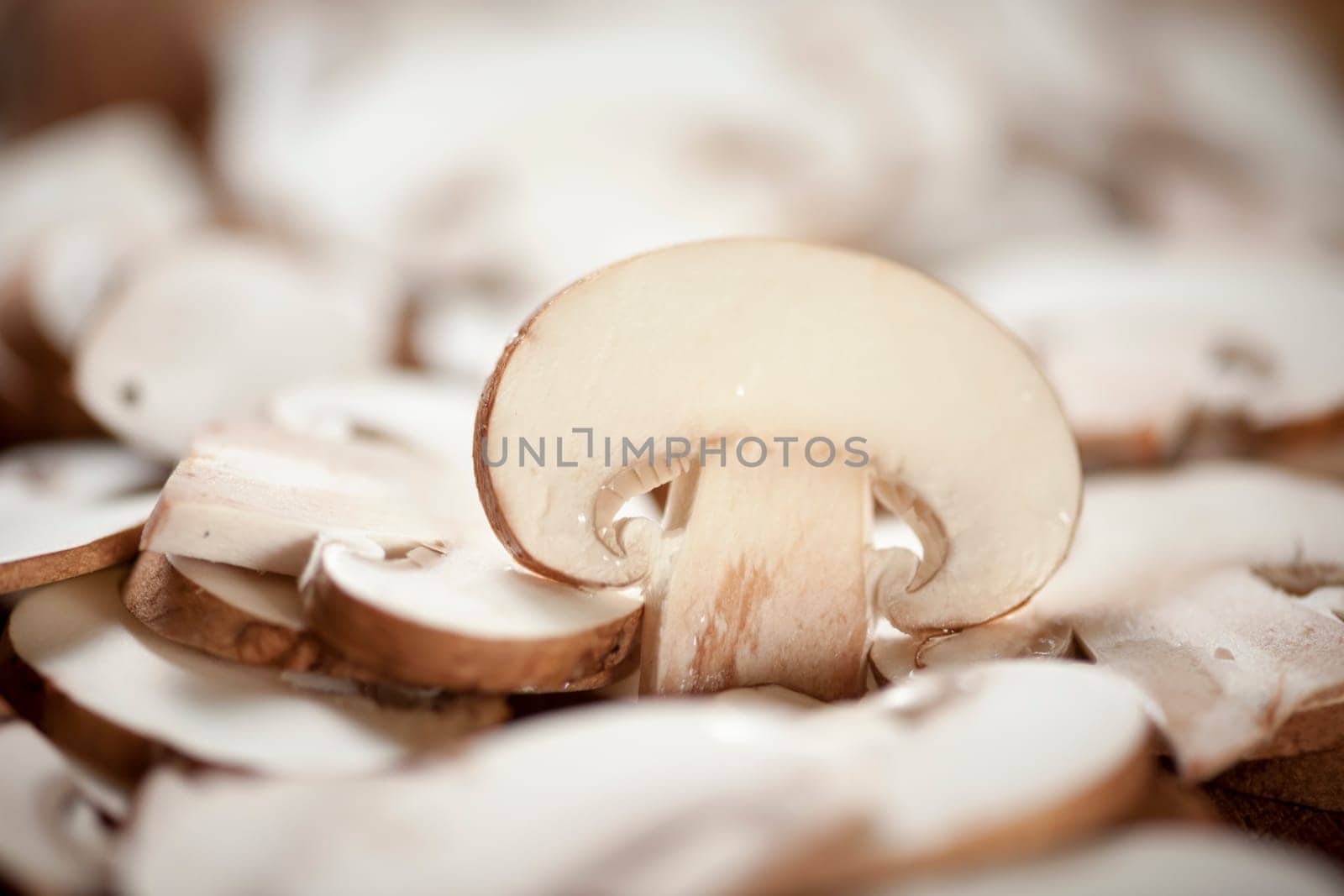 Format-filling view of sliced mushrooms with individually upright positioned piece.
