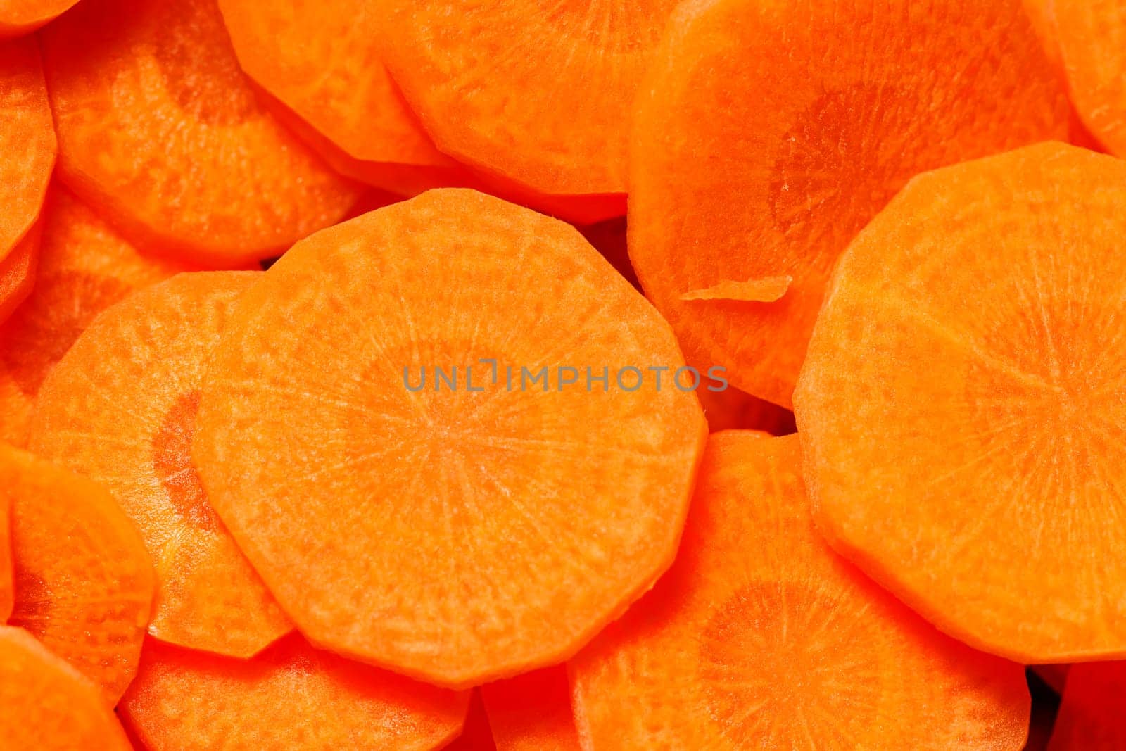 Format-filling close-up of sliced carrots: