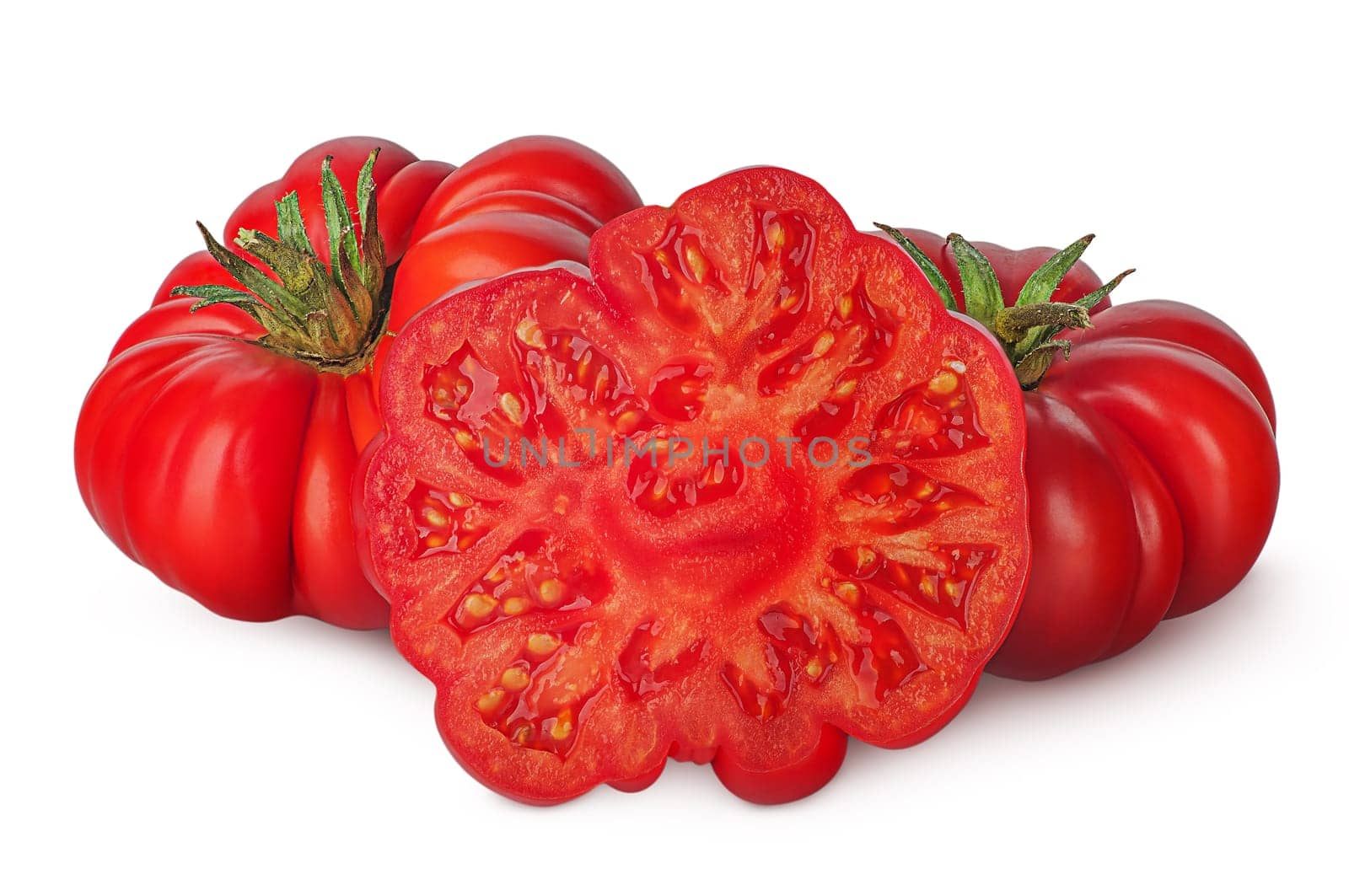 Whole and part of heirloom tomatoes isolated on white background