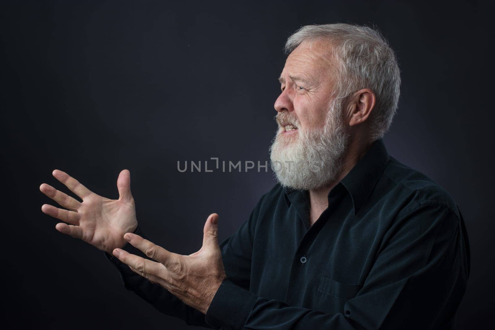 Old man with beard praying for someone and asking for something