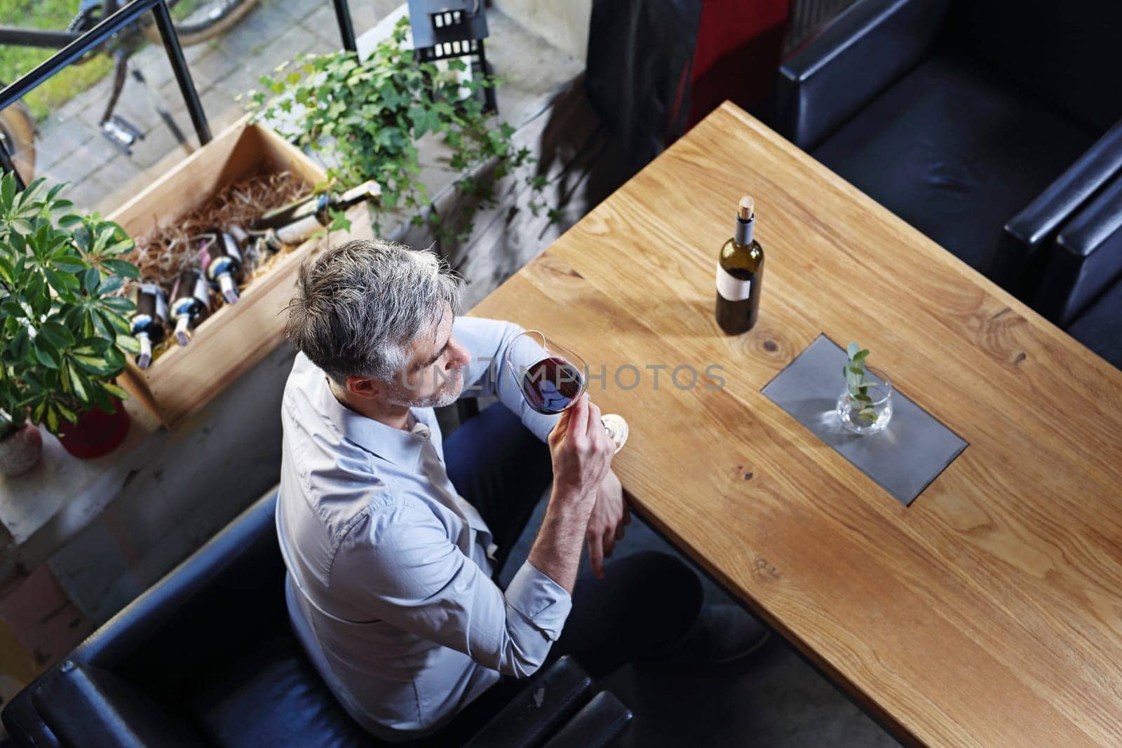 A glass of red wine. Handsome man drinking wine. Man drinking wine.